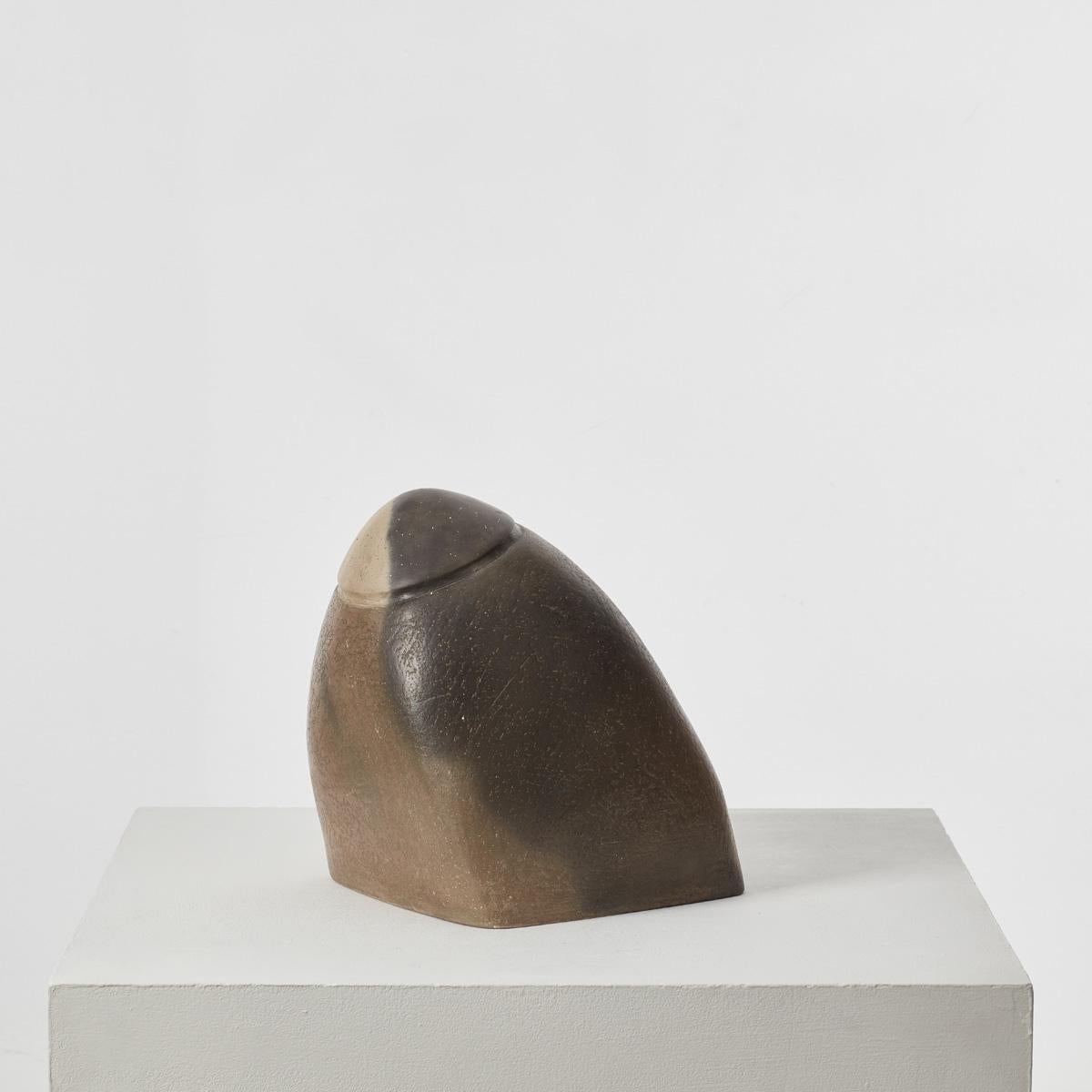 A large, biomorphic plaster sculpture with a burnished finish that sits as a solid piece with a dynamic slanted axis. It was previously owned by Sir Terence Conran (1931 – 2020). Conran, an inimitable design pioneer and businessman, “did more than