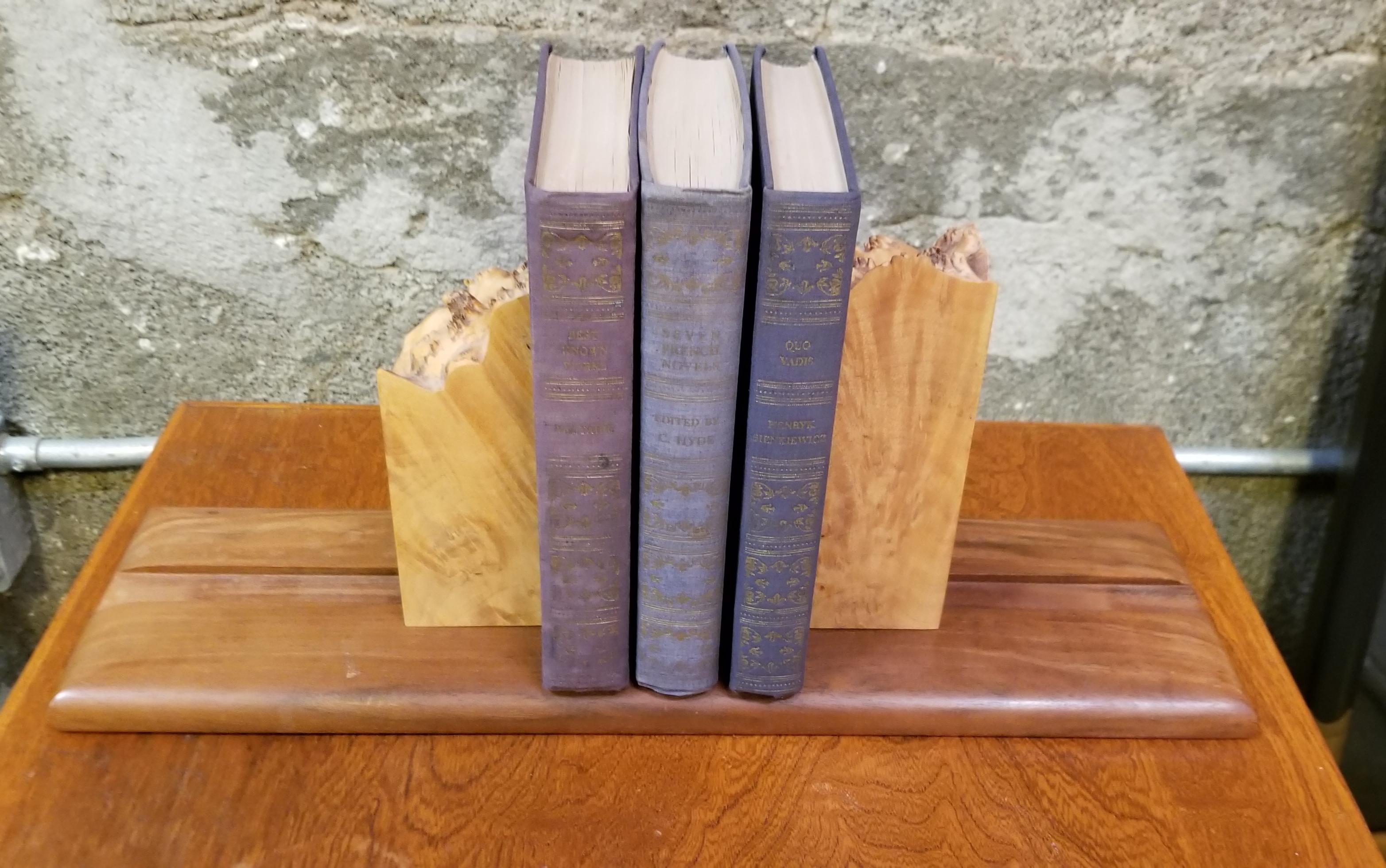 Michael Elkan's live edge bird's-eye maple and solid walnut organic bookends. Sliding, adjustable feature to accommodate number of books supported. Signed on base.

