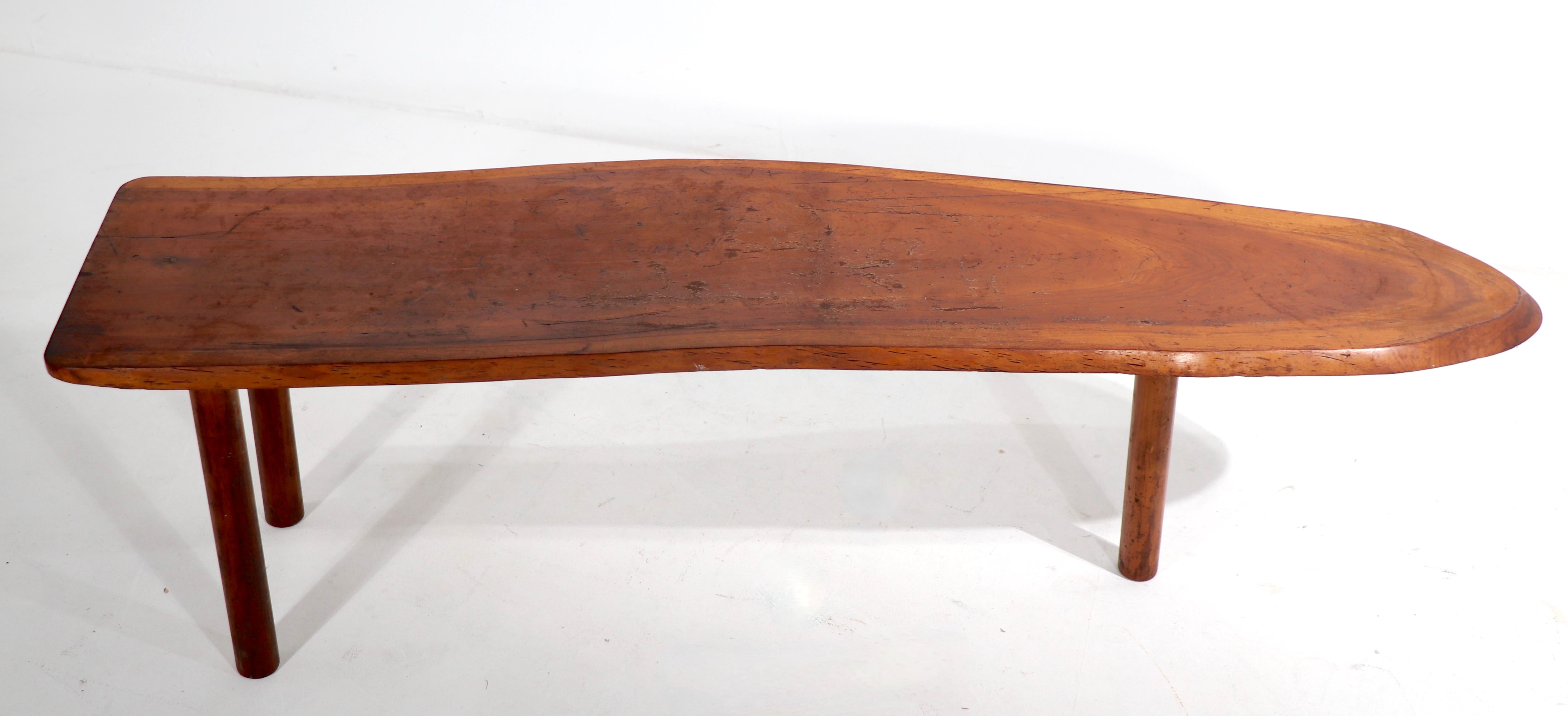 Classic free form, live edge Mid Century Organic Modern coffee table, in the manner of George Nakashima, and Roy Sheldon. The table is structurally sound and sturdy, the top shows cosmetic wear normal and consistent with age.