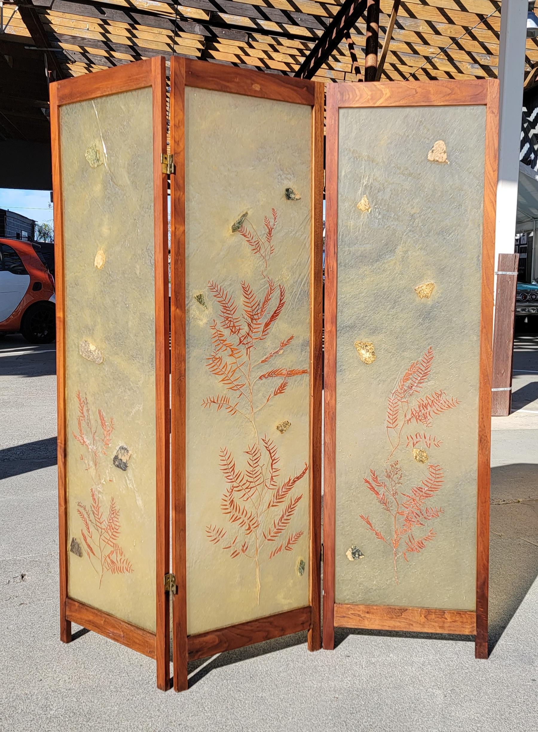 Unusual 3 panel screen with translucent panels featuring fern leaves and organic objects. Solid walnut frame. Excellent original condition. Notice last two images are with sunlight behind screen. Could be modified into a striking back lit wall