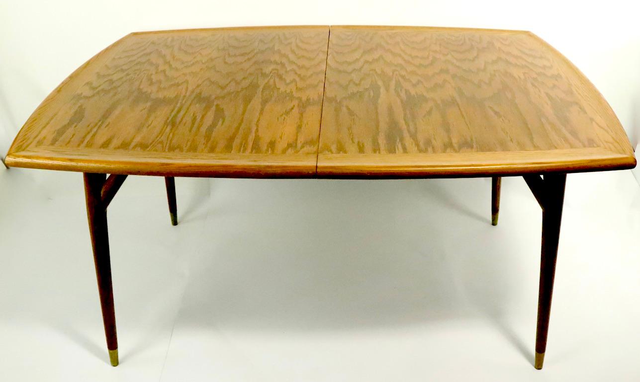 Sophisticated and chic organic modern extension dining table from the Americana Casual series designed by Jack Van der Molen for the Jamestown Lounge Company. This impressive table features a sculpted top, with organic tree like legs, each with a