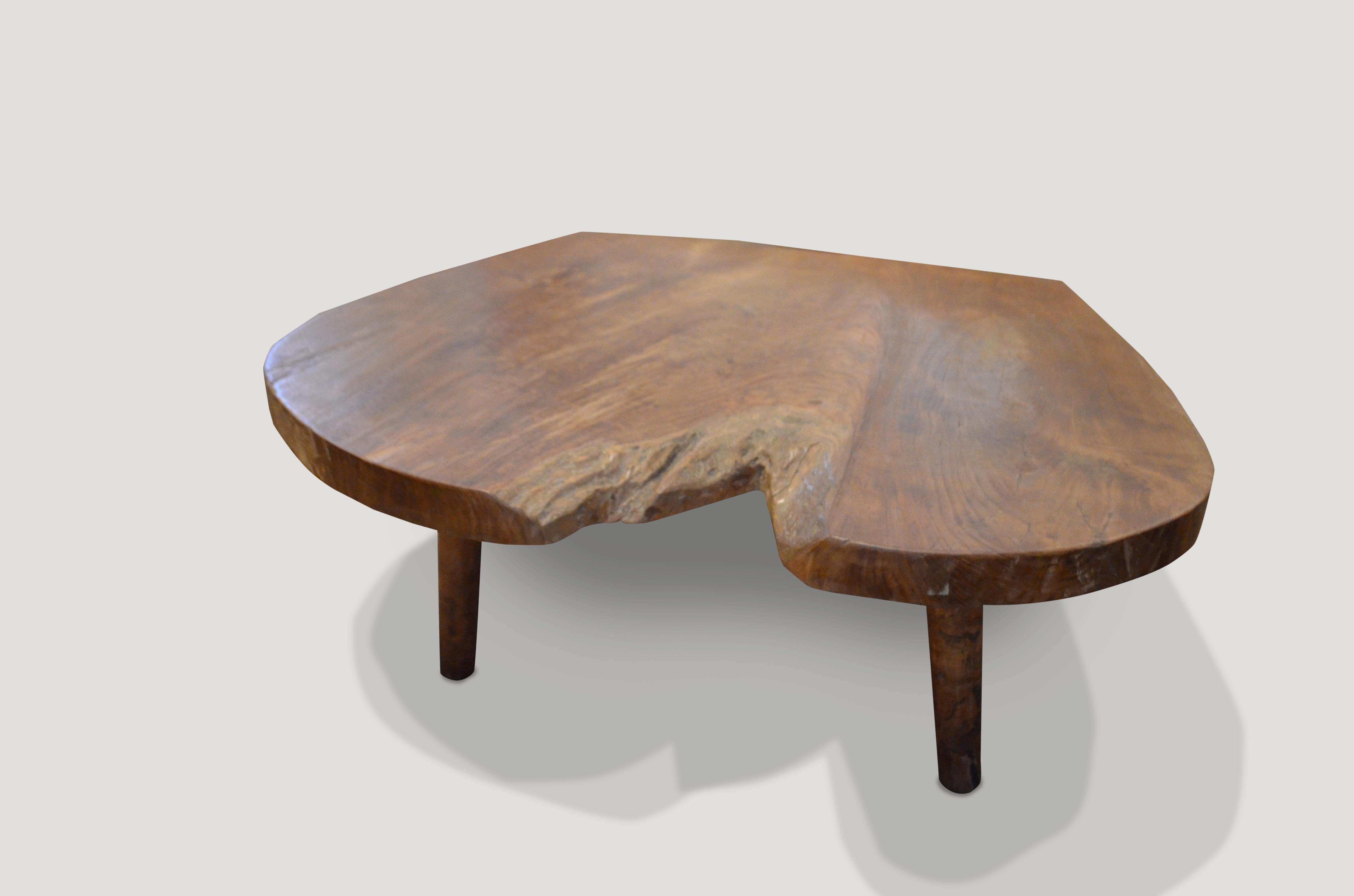 Reclaimed single slab teak coffee table with a natural oil finish. Floating on mid century style legs.

Own an Andrianna Shamaris original. 

Andrianna Shamaris. The Leader In Modern Organic Design™