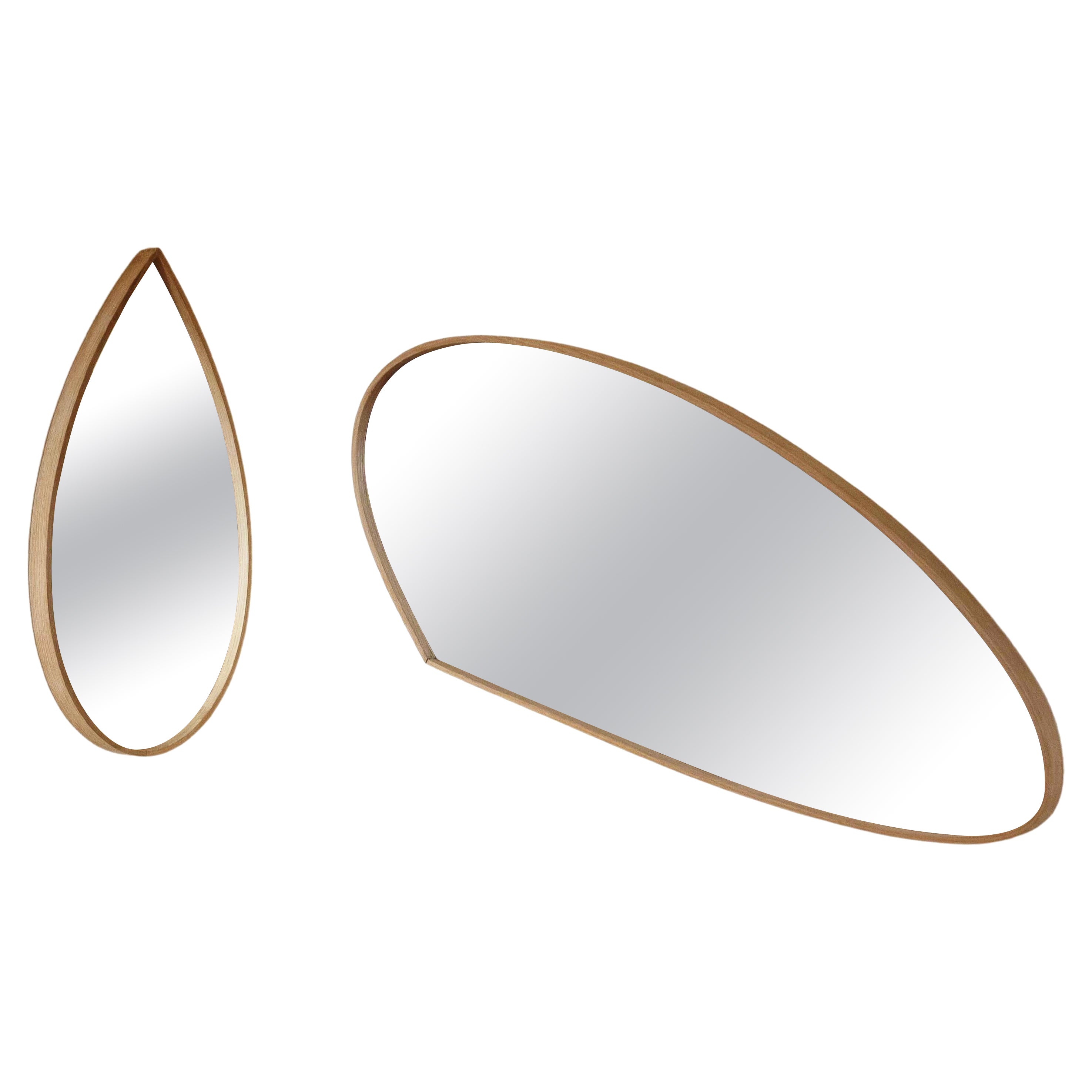 This wall mirror by Soo Joo uses wooden steam-bending techniques to create an Organic Mirror design. They have a timeless beauty that is not affected by changing trends and can be enjoyed for decades. The sculptural mirror fits into any interior