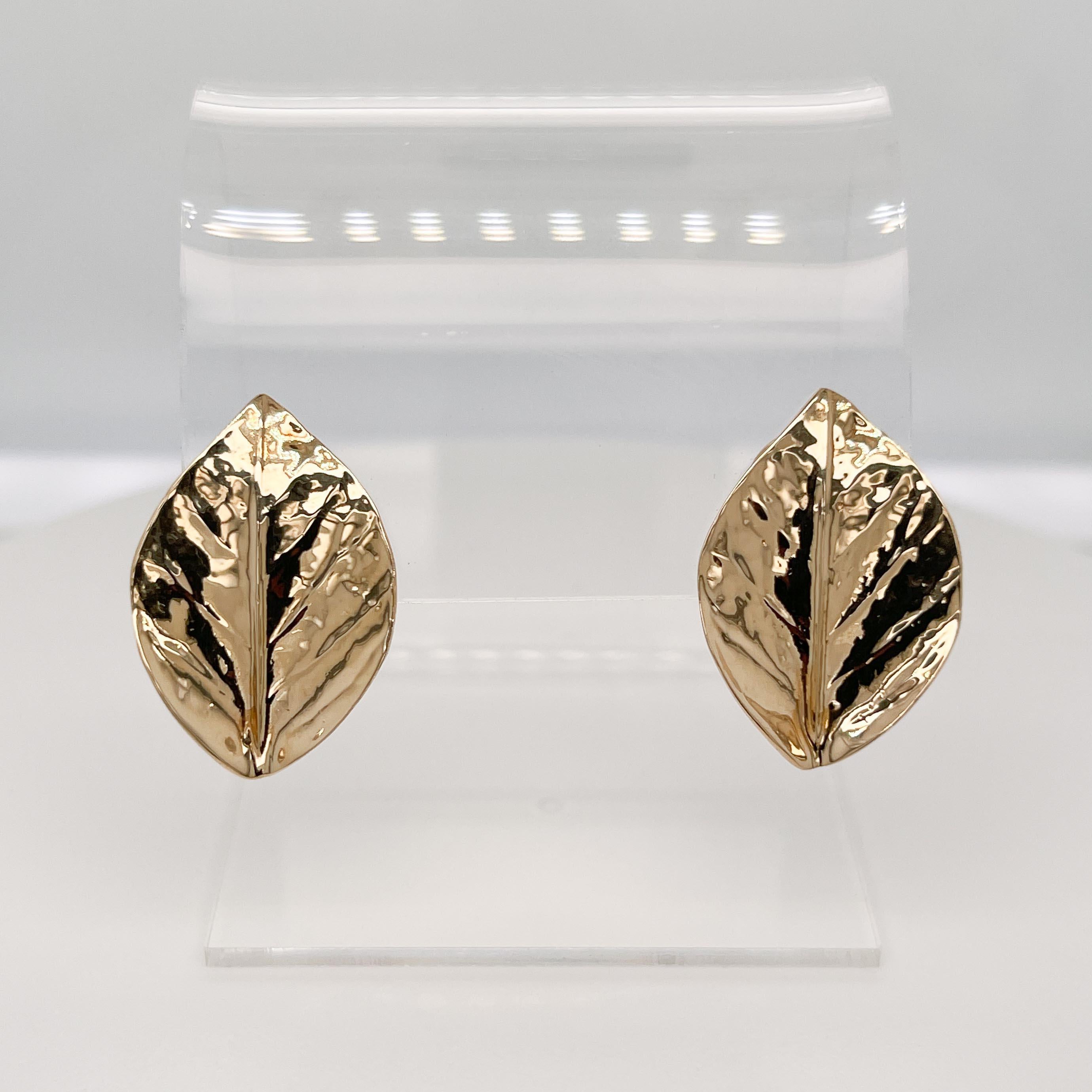 A fine pair of gold leaf-shaped earrings.

With a textured surface on front and omega clips to the back.

Simply a finely crafted pair of earrings!

Date:
20th Century

Overall Condition:
They are in overall good, as-pictured, used estate condition