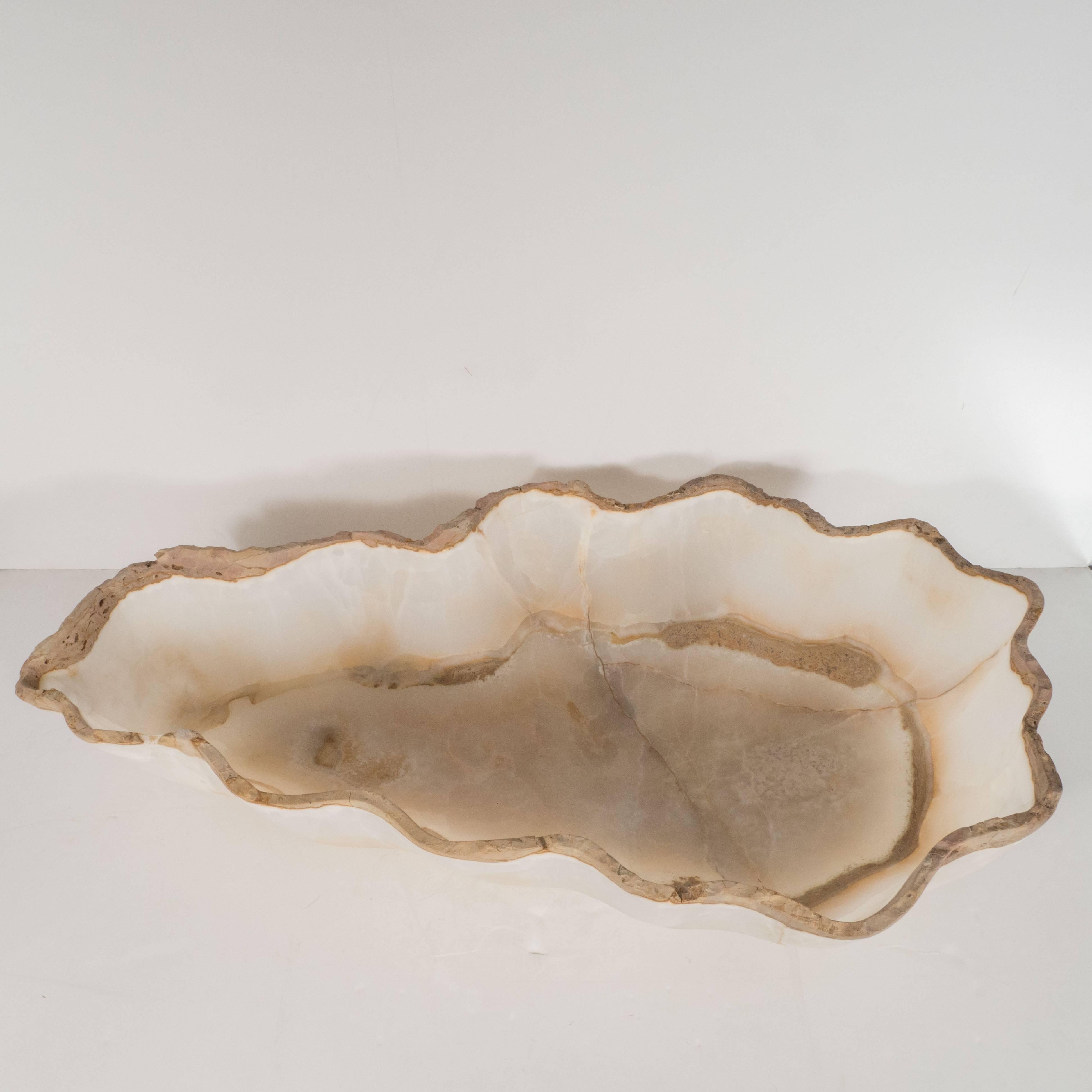 This compelling organic modern agate bowl features a wealth of texture in honeyed tones of sand and oyster shell, showcasing the inherent beauty and understated elegance of nature at its most refined. It would be a winning addition to any style of