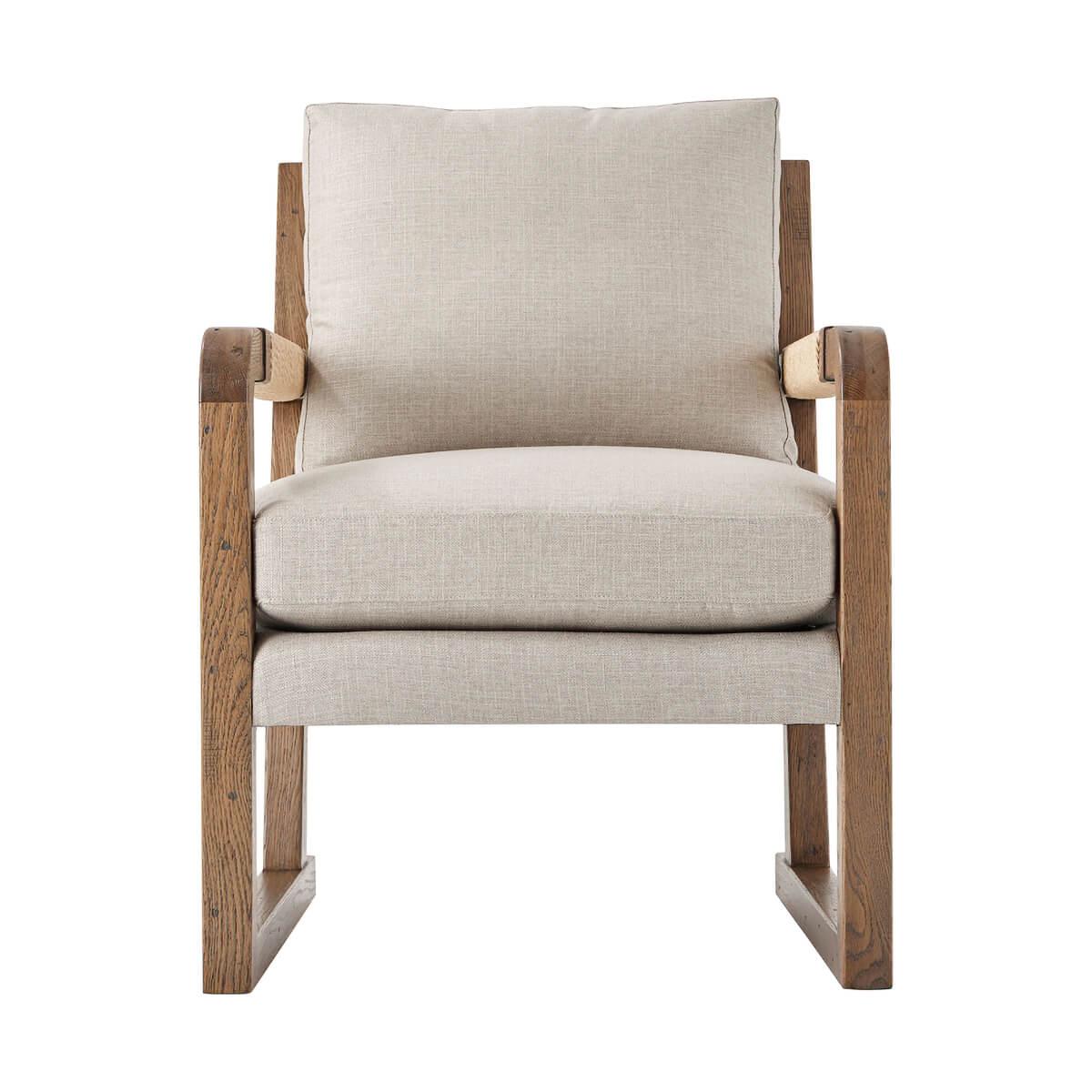 A rustic organic modern style armchair in our light oak finish, with handwoven faux rush paneled back with loose cushion backrest and seat, the open arms with faux rush wrapped details. The cushions are in a performance fabric.

Dimensions: 27