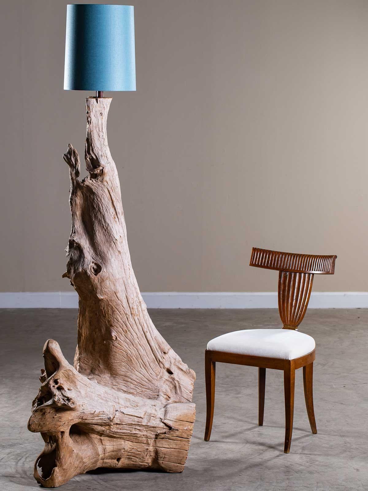 Incredible organic modern driftwood floor lamp crafted entirely by nature. Harvested from the shores of Southeast Asia this one of a kind floor lamp exhibits all the natural signs of having been tumbled in the ocean. The play of light and dark