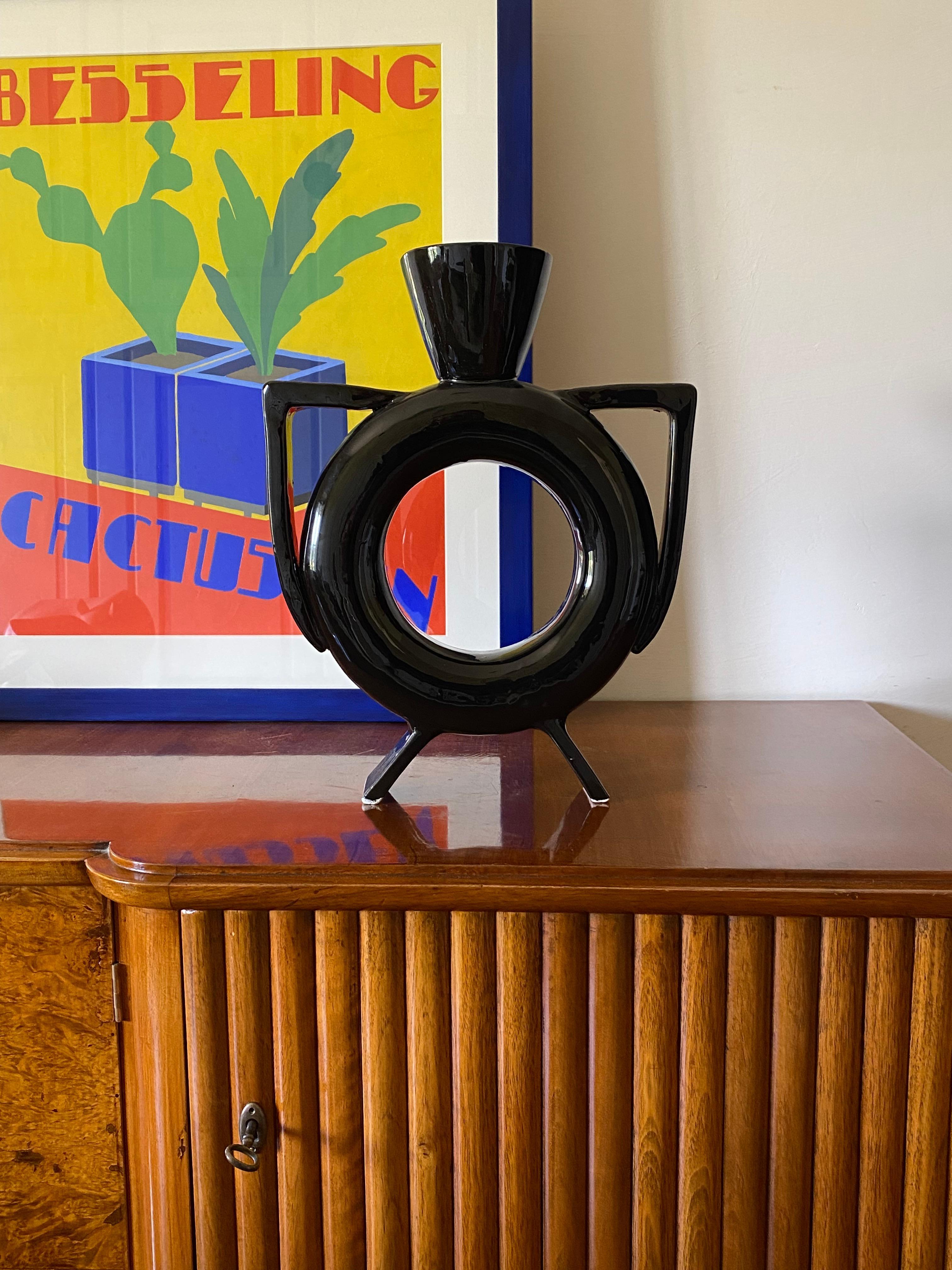 Organic modern black ceramic vase

Italy 1980s

H 39 cm

32 x 8 cm

Conditions: excellent, no defects