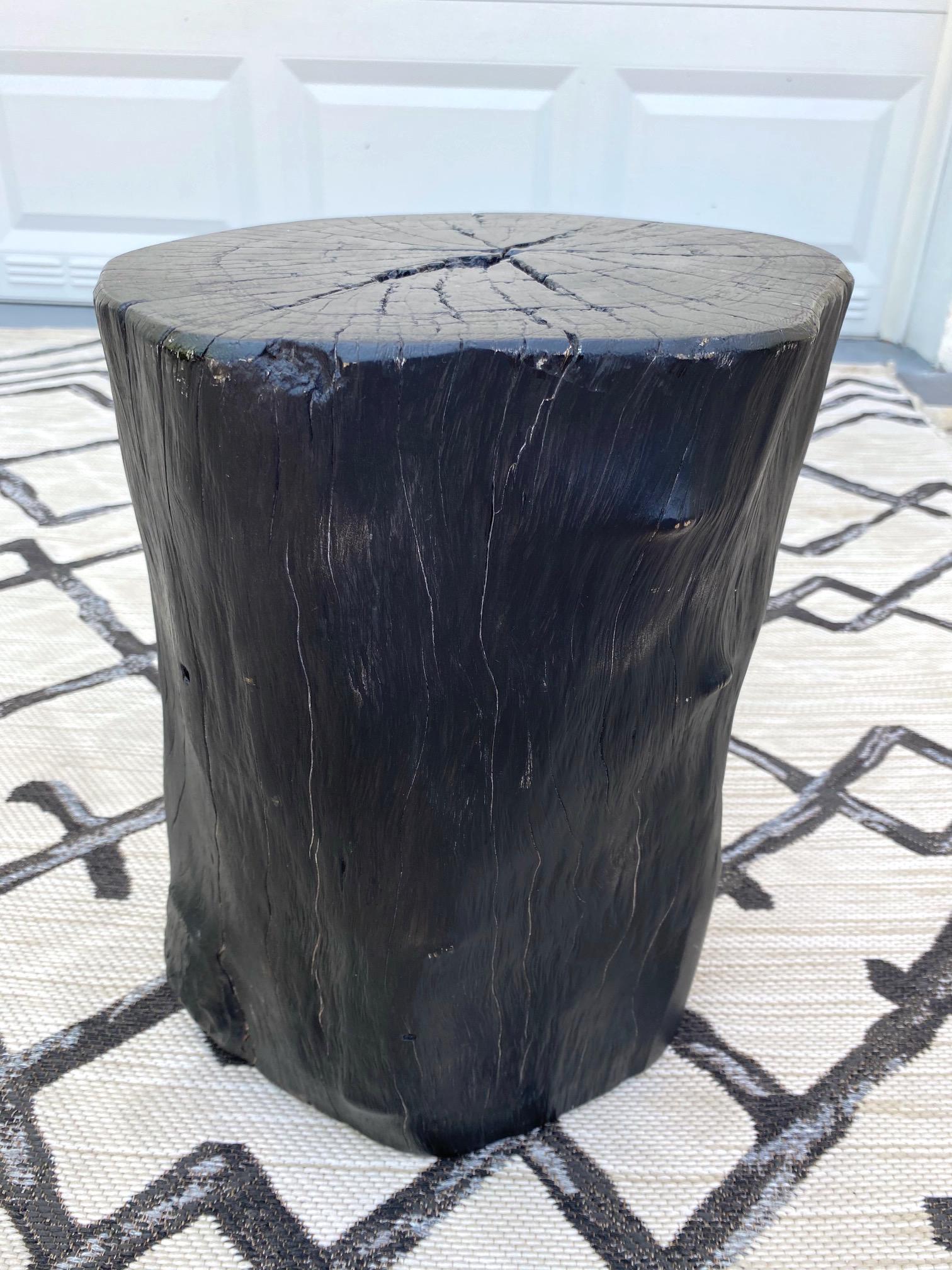 Indonesian burnt and blackened teak wood stump with organic modern design. Makes a gorgeous accent piece for a bathroom or can be used as a drink table or side table. Excellent condition with minor natural variations of lighter wood tones