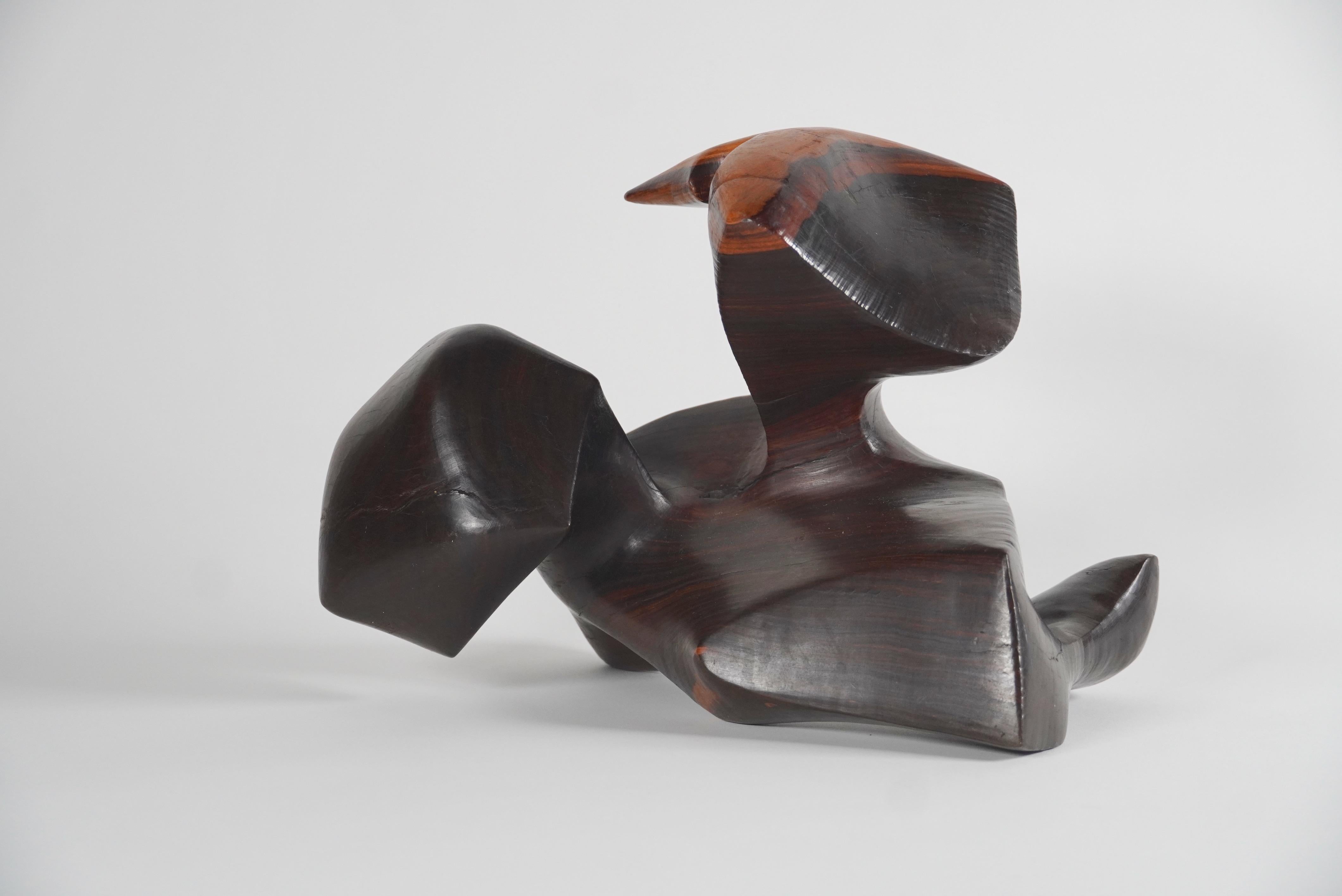 Free form Organic Modern abstract sculpture hand carved out of solid rosewood finely sanded and polished to have a natural luster.