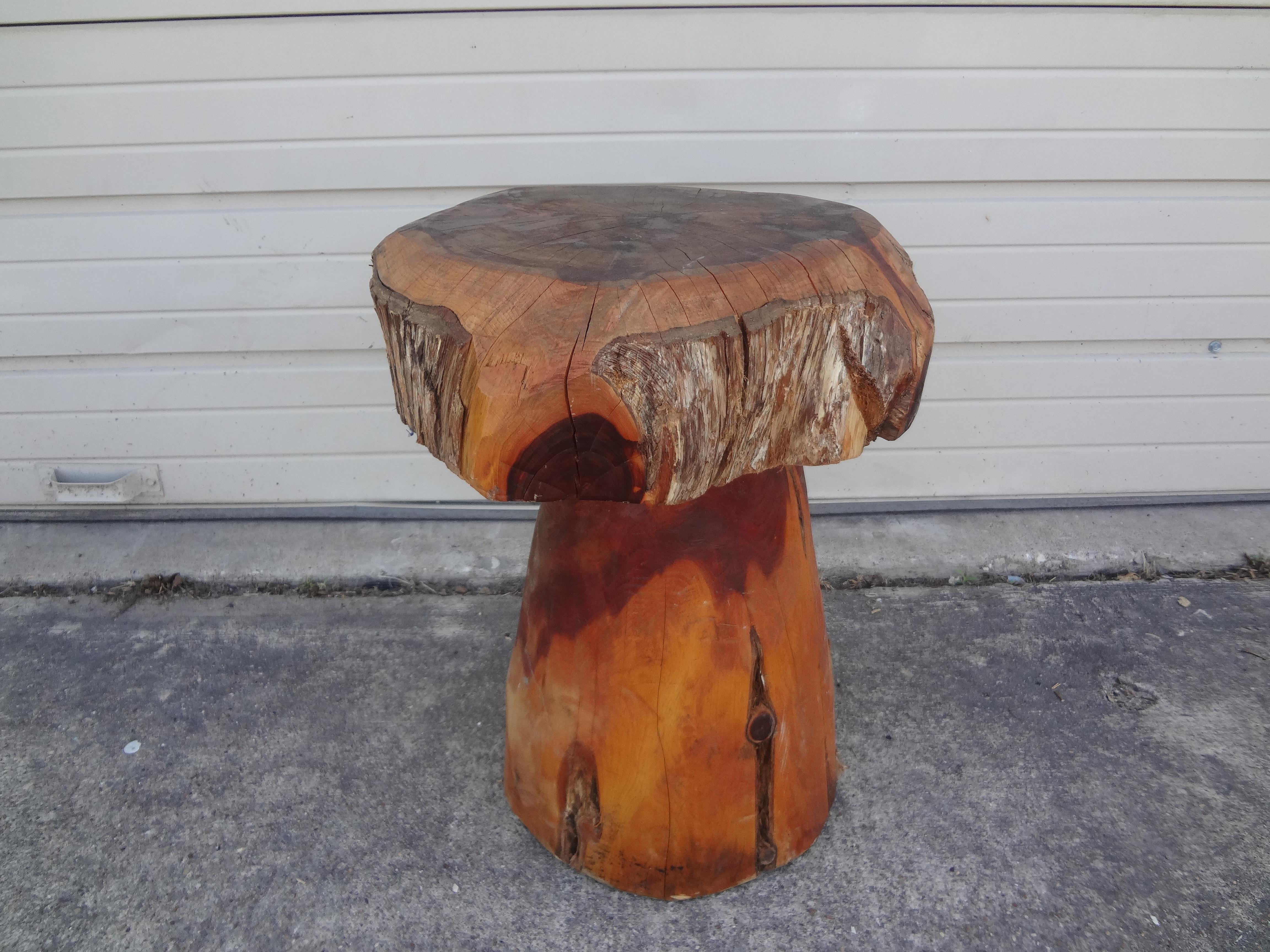 Organic modern carved wood mushroom table. This handsome 20th century carved wood table in the shape of a mushroom is a great side table that works 
in many interiors.