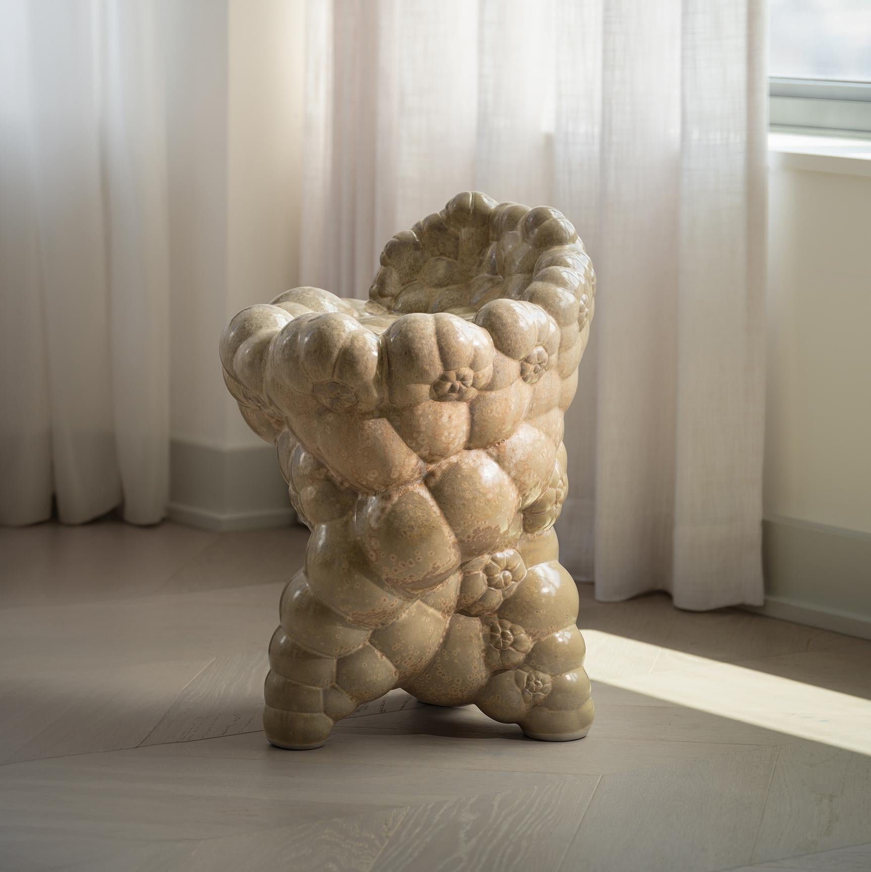 This ceramic crafted stool displays experimental glazework dripping and following its unique form. Its form has been digitally designed by our studio to ressemble a fractal like growth as in nature, and then handcrafted in experimental