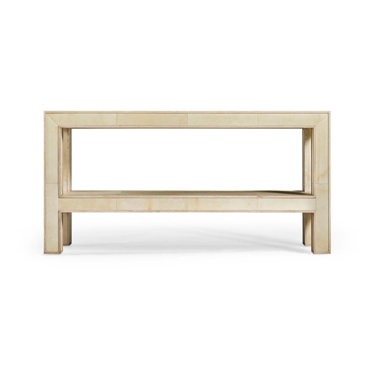 
A testament to refined craftsmanship and minimalist design. With its oak frame, this console exudes both strength and grace.

The surface is a tapestry of genuine, untreated parchment squares, carefully sealed with a clear coat for a durable