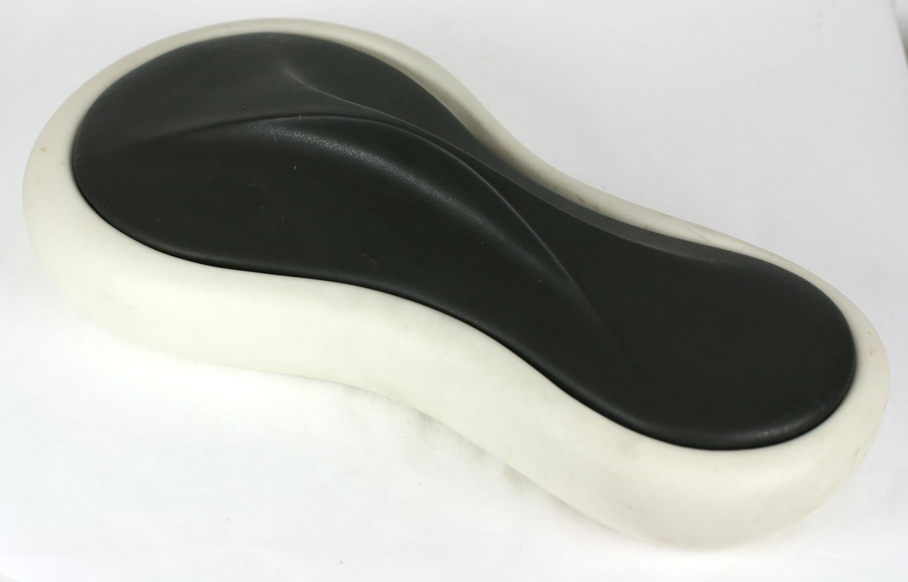 Covered pottery dish by Industrial designer Arno Scheiding from the 1950s. Great combination of colors in matte white and matte black highlight the elegant lines and biomorphic midcentury form. The handle is formed by a gently raised curve in the