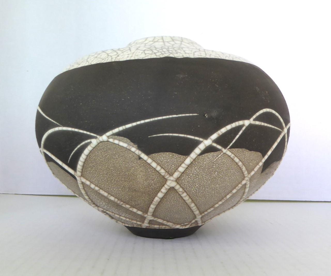   Organic Modern large bulbous Raku Pottery Vase from Evans Ceramics from California, 1970s. Mixture of ivory crackle glaze and band of matte dark brown surface grace this creation. Signed in gold paint EVANS RAKU 643. Beautiful form and elegant