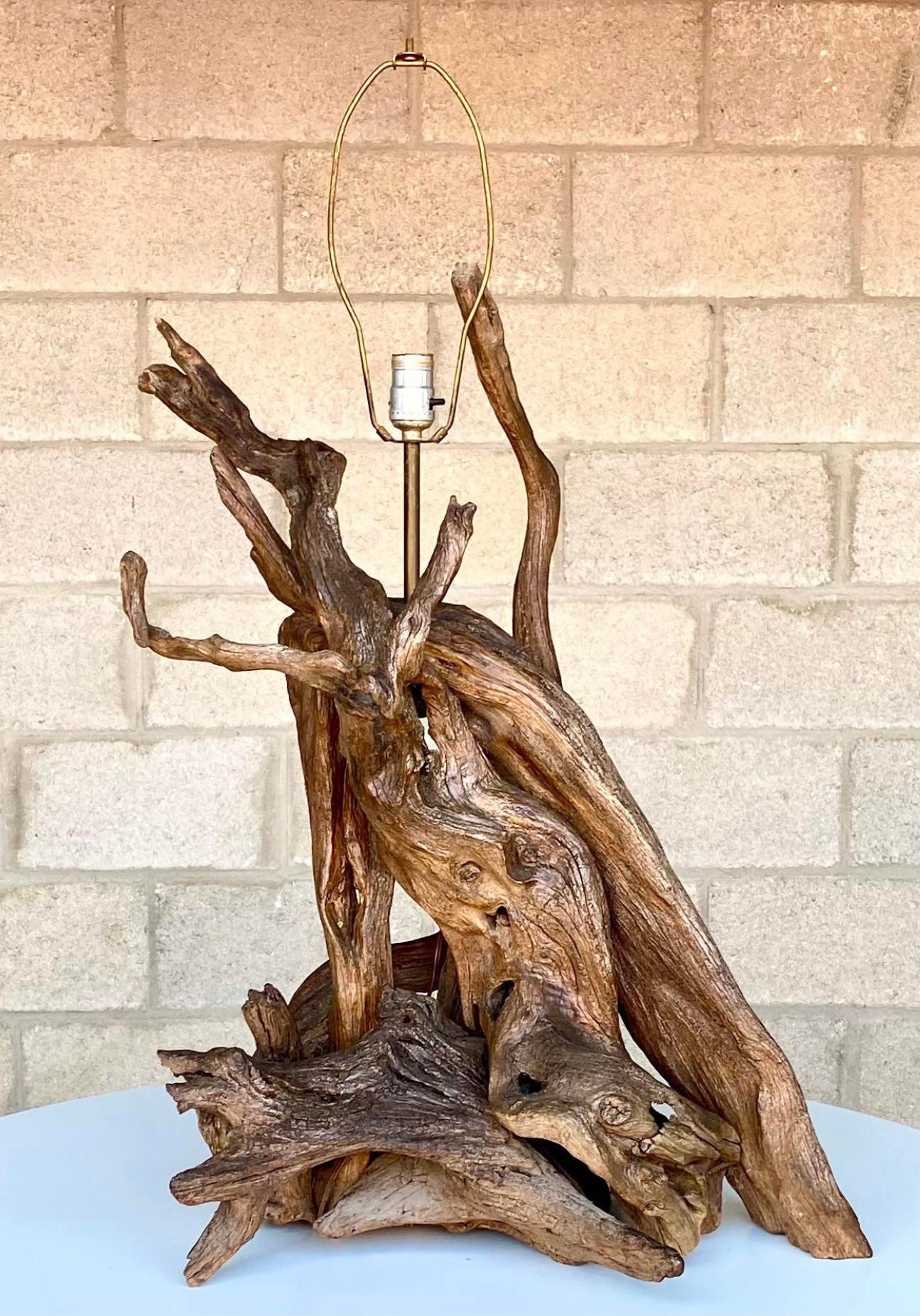 Fantastic vintage driftwood lamp. Beautiful organic modern style with heavy rustic branches. A tall composition of gnarly wood. Acquired from a Palm Beach estate.