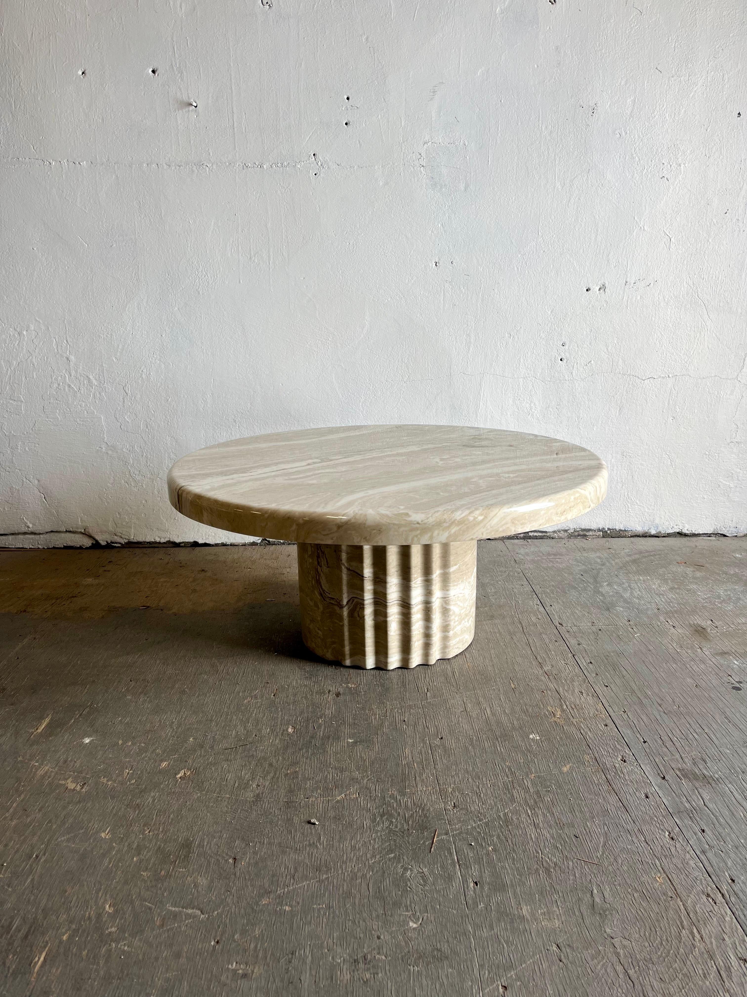 Stunning organic modern faux marble resin coffee table. Subtle but packs a punch. Beautifully grained top surface sit atop a semi fluted base. Low and powerful.
Curbside to NYC/Philly $450