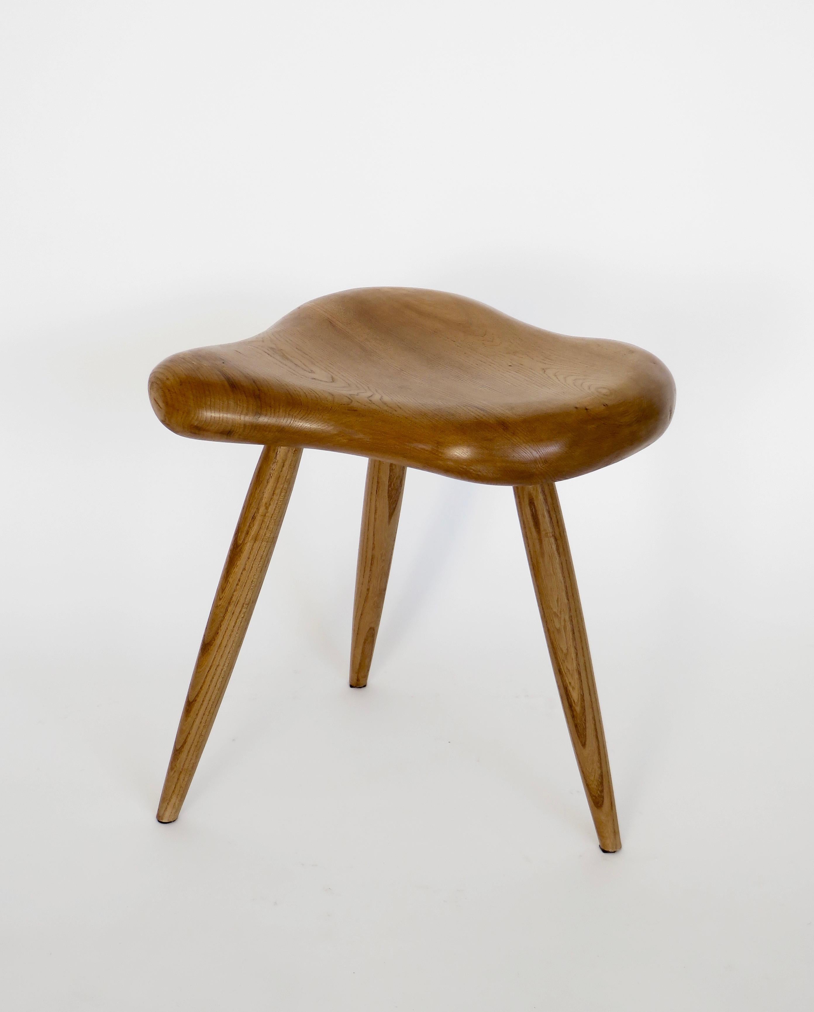 An organic freeform French elm wood stool in the taste of Alexandre Noll.
This stool is made from French elm wood. Suitable for using as a stool or a small side table.
The top is hand carved and is an undulating organic form with spindle hand turned