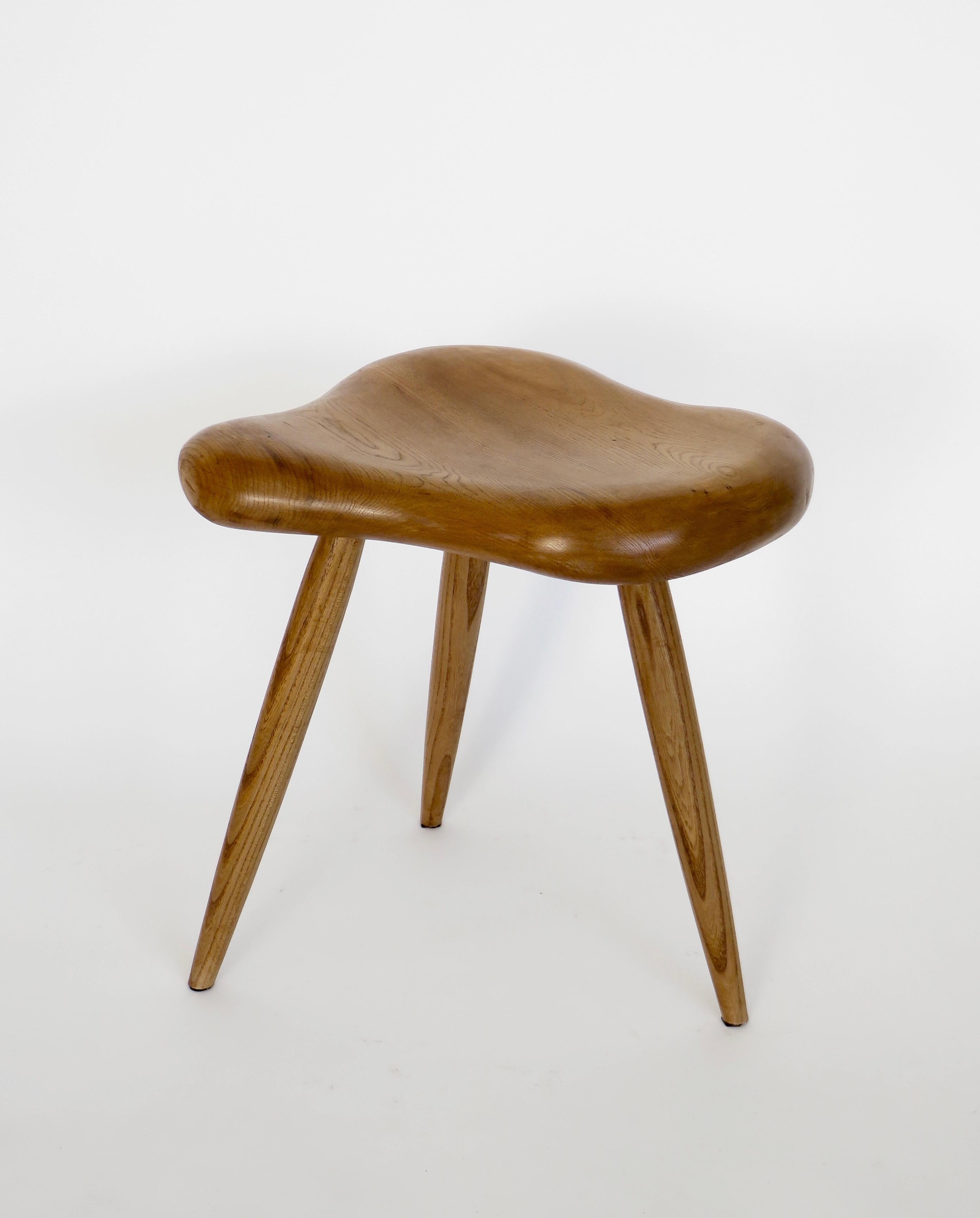 An organic freeform French elm wood stool in the taste of Alexandre Noll.
This stool is made from French elm wood. Suitable for using as a stool or a small side table.
The top is hand carved and is an undulating organic form with spindle hand