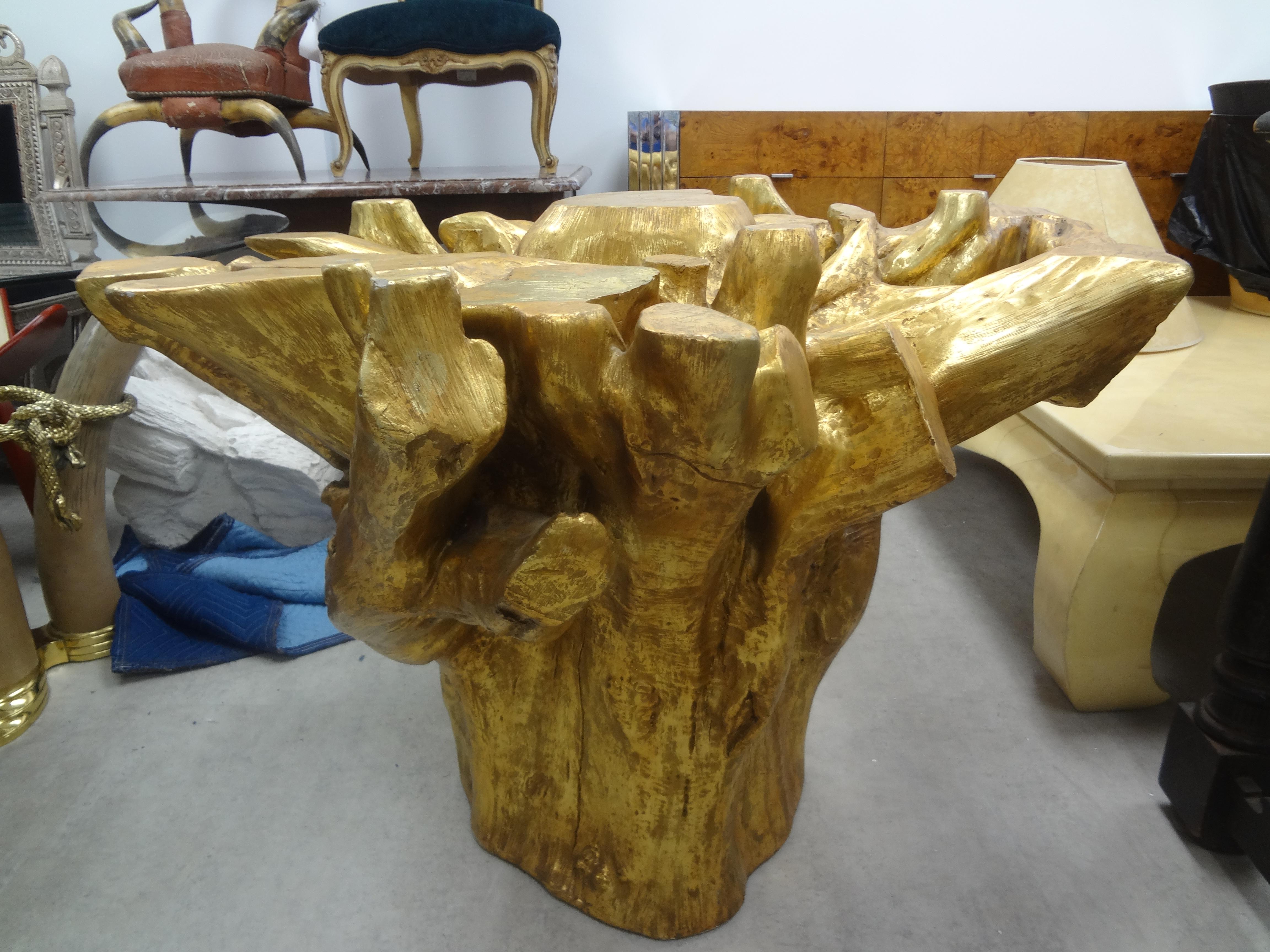 Organic modern gilt faux bois tree stump table base. This stunning vintage table base is in the shape of a tree stump with a gilt finish. This realistic tree stump table base can be used as a center table, game table or dining table by adding your