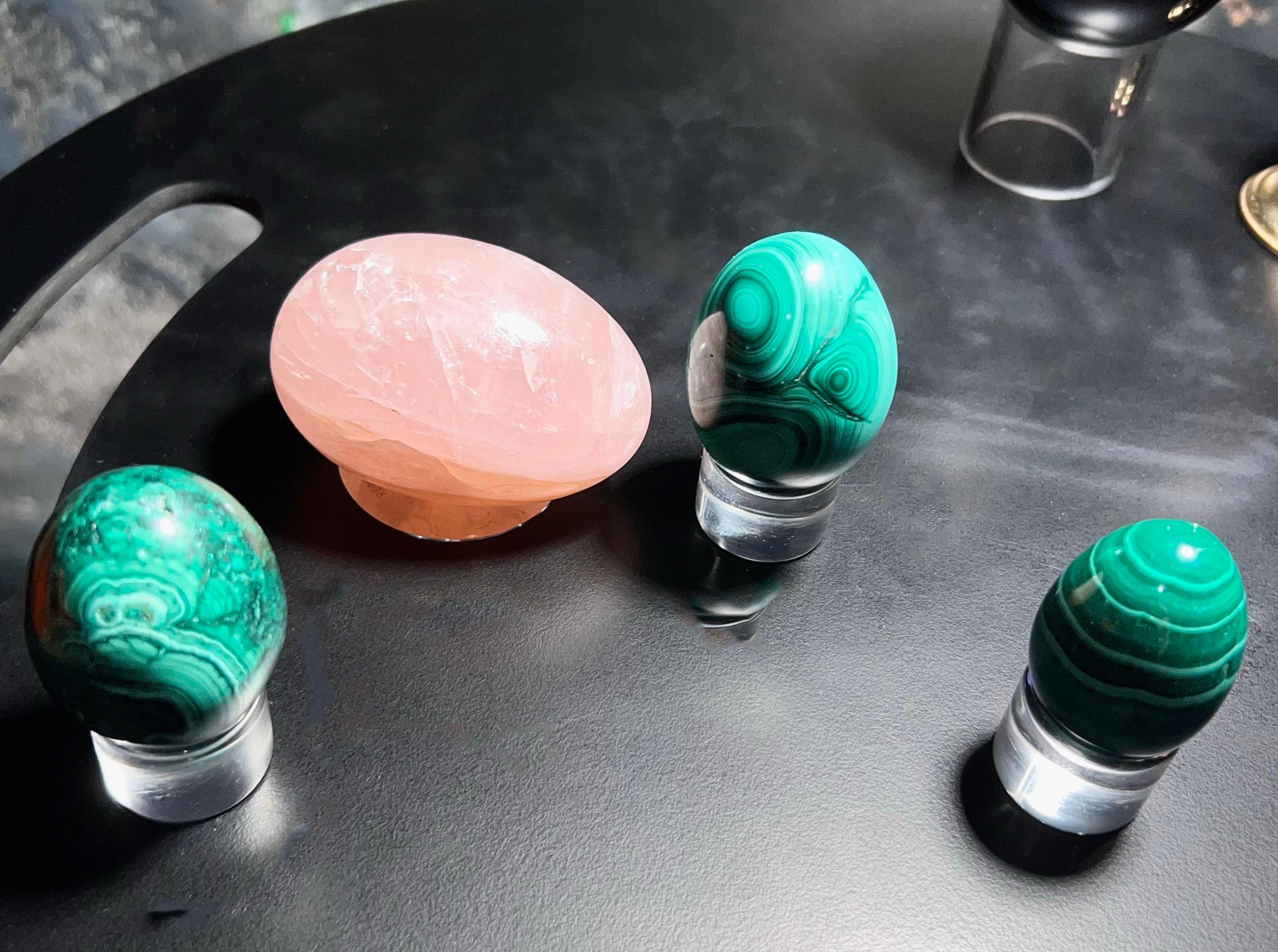 Organic Modern Hand Carved Malachite and Rose Quartz Egg Sculptural Set of 4.  Midcentury green malachite hand-burnished egg set of 3 with one large rose quartz egg. Carefully curated set with three lucite bases. 