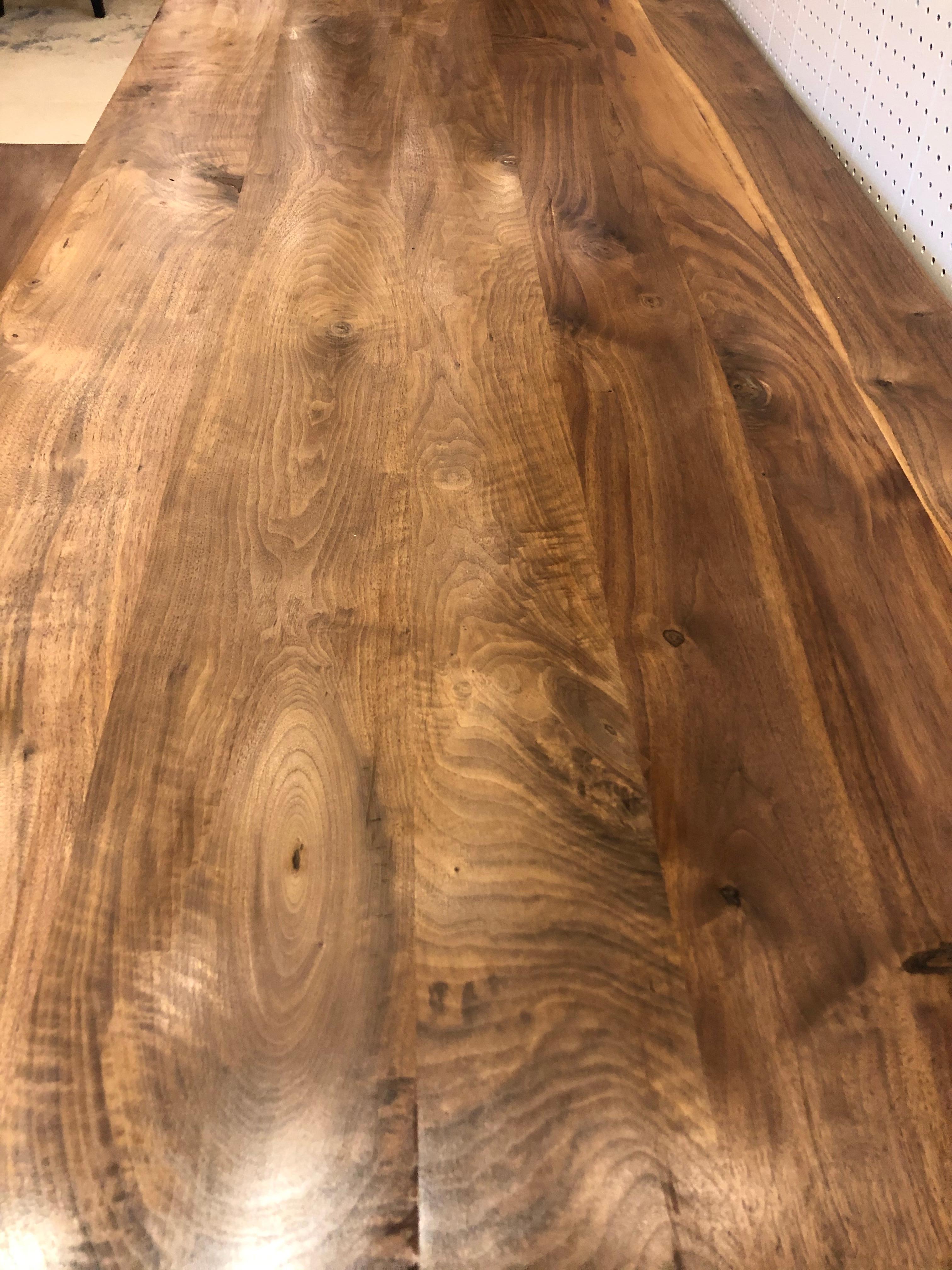 Hand crafted black walnut slab farm table having gorgeous grain and simple black ebonized apron and straight legs.
Custom bench available for $650
Measures: 60 L x x 19 H.
