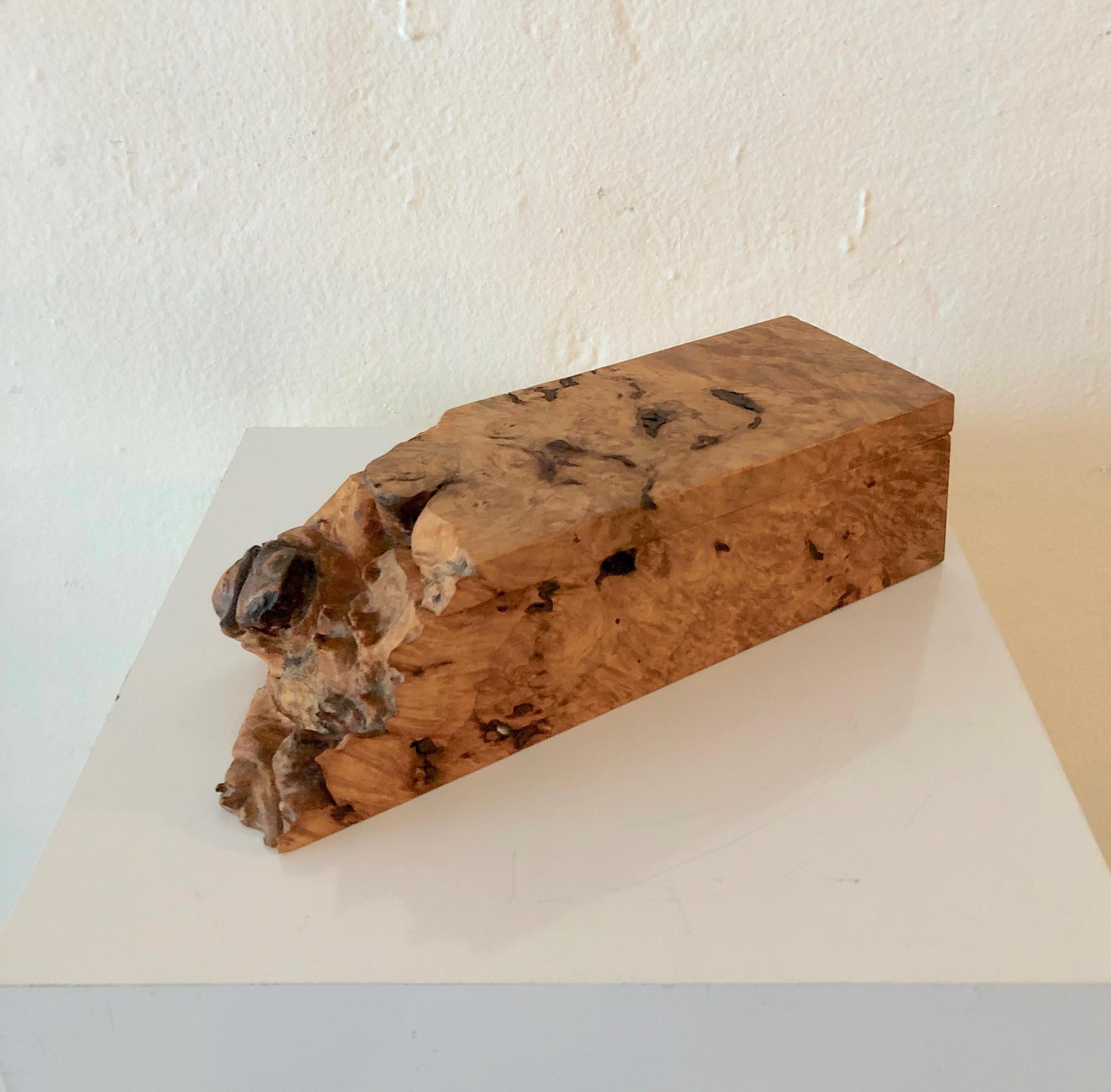 Crafted by master woodworker Michael Elkan this lidded box made of burl wood has a live edge left natural for an organic natural look which was a signature of his work. Michael Elkan boxes and wood work is collected and was so well regarded that
