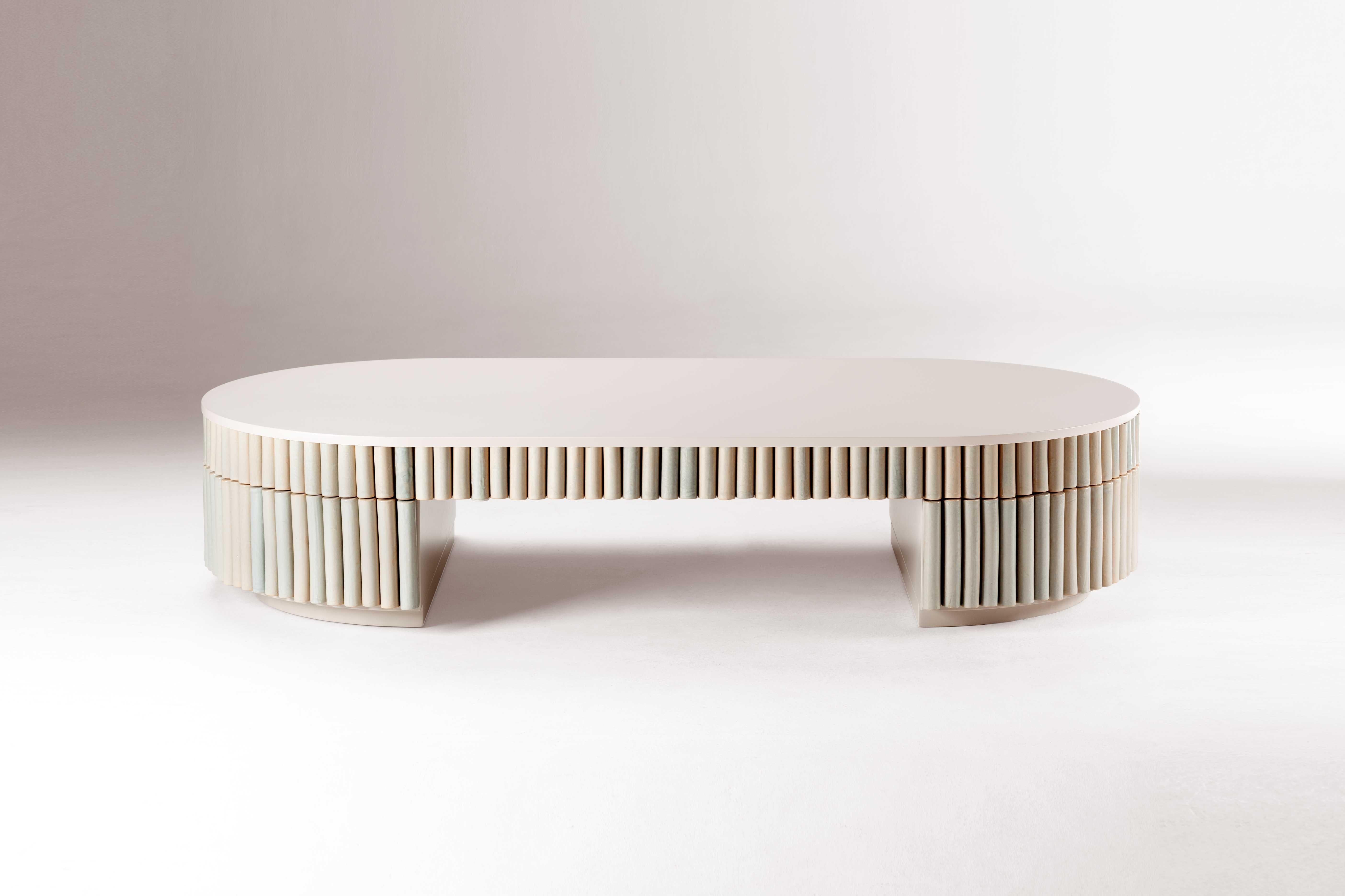 Exceptional in its craftwork, Nouvelle Vague is a center table that rejects traditional conventions in favor of experimentation. Round ceramic handmade pieces, painted in a unique craquele glaze are placed around a lacquered center top, creating a