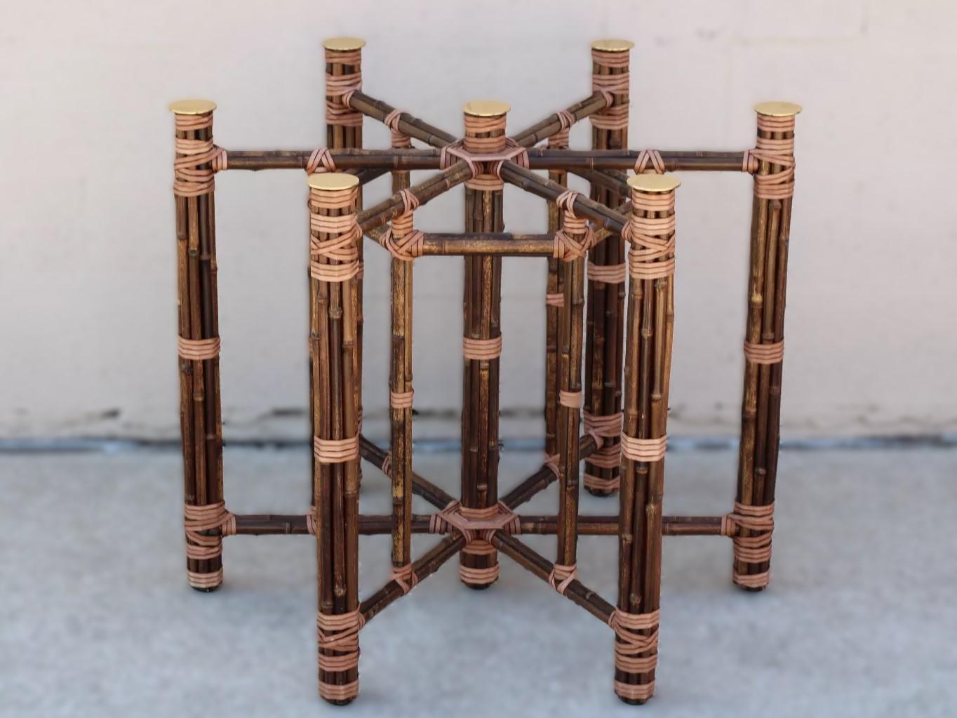 Genuine McGuire organic modern bamboo rattan hexagonal dining table or center table base. This organic modern table base includes seven optional brass caps and was designed to be used with a round glass top. This beautiful piece is genuine McGuire,