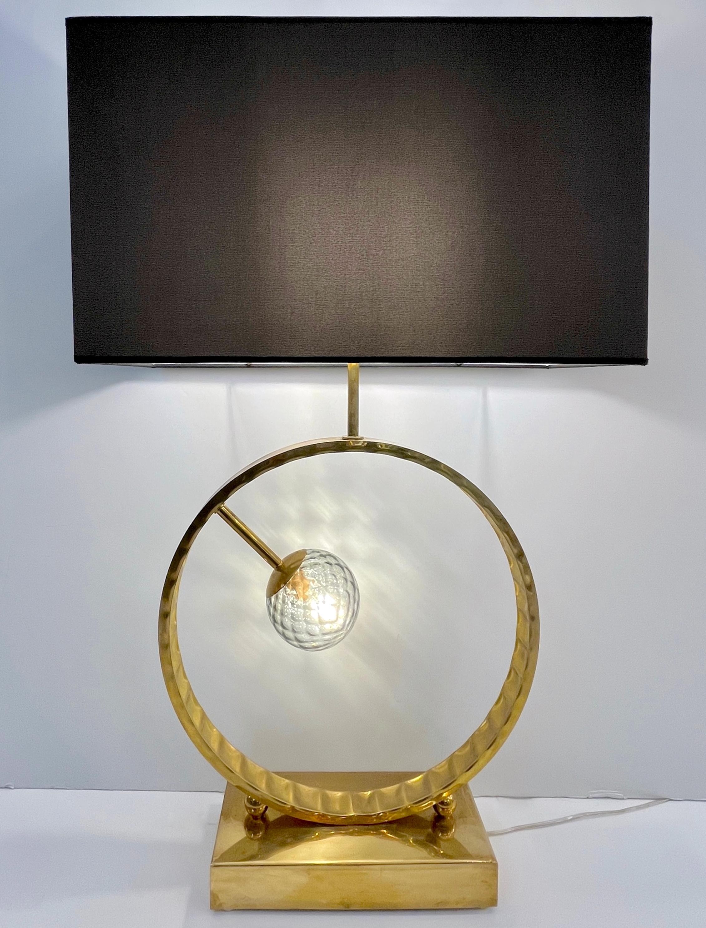 2 Available - The Murano glass globe can be chosen in different colors, see image - A contemporary highly decorative tall table lamp of grand size, entirely handcrafted in Italy, with an enticing minimalist geometric design, the body consisting of