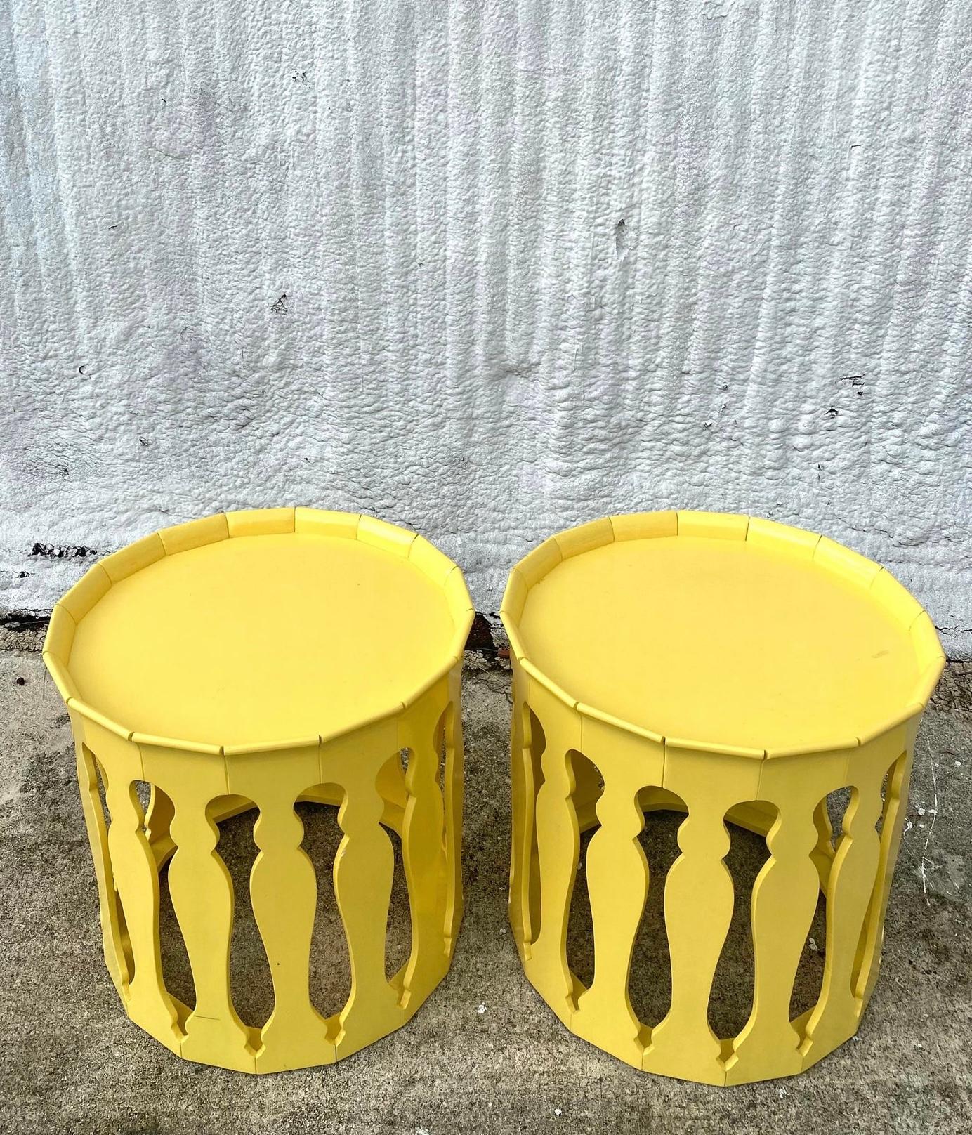 Incredible pair of Johnathan Charles side tables. The iconic “Yellow Raincoat” design. A chic Moorish design with a brilliant yellow lacquer finish. Acquired from a Palm Beach estate.