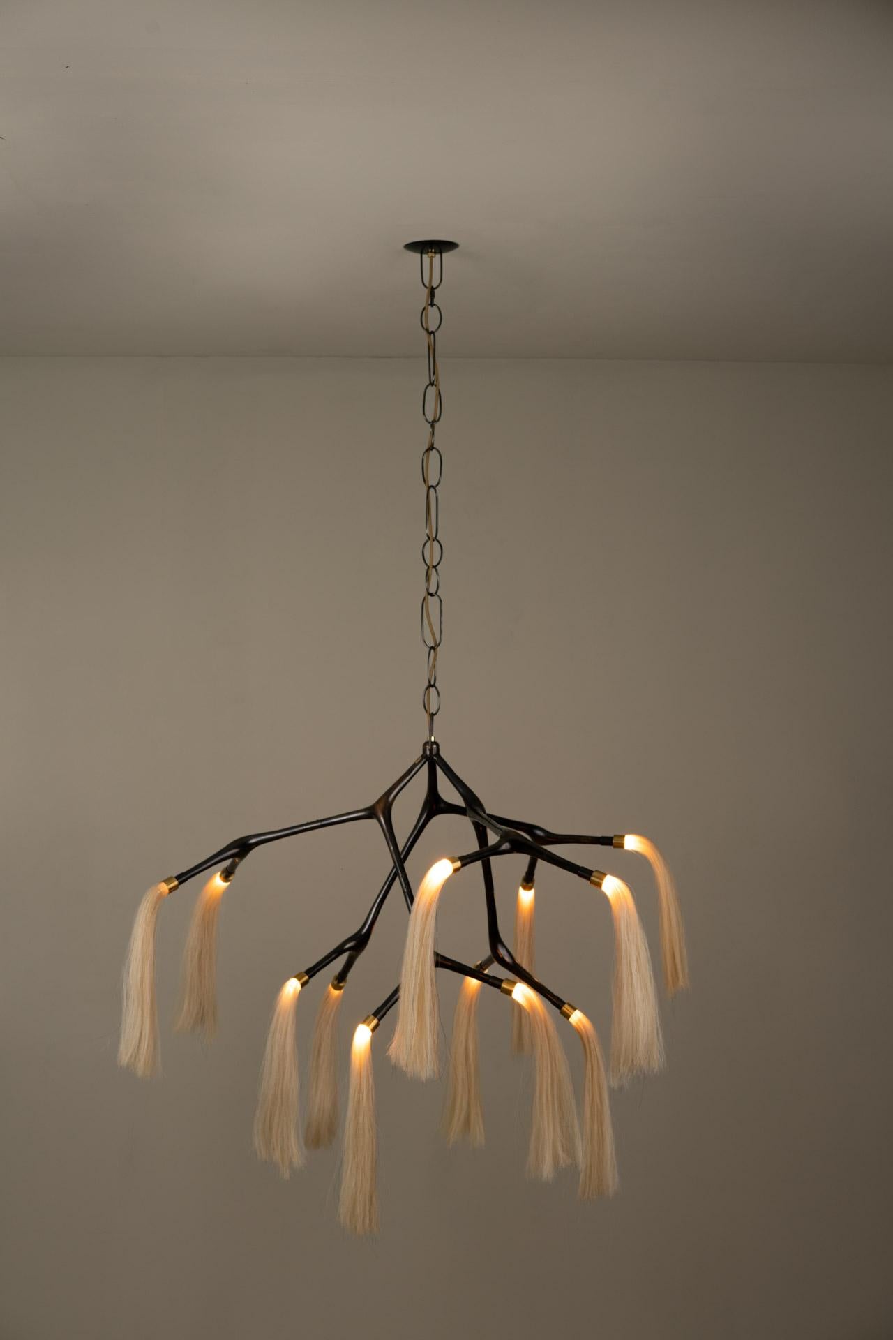 MARATUS chandelier was designed for the Mol collection by Mexican artist Isabel Moncada.

A chestnut horse with a white tail is called Palomino, it is dashing and atypical. This lamp is an allegory of its sumptuous presence. The vintage finish