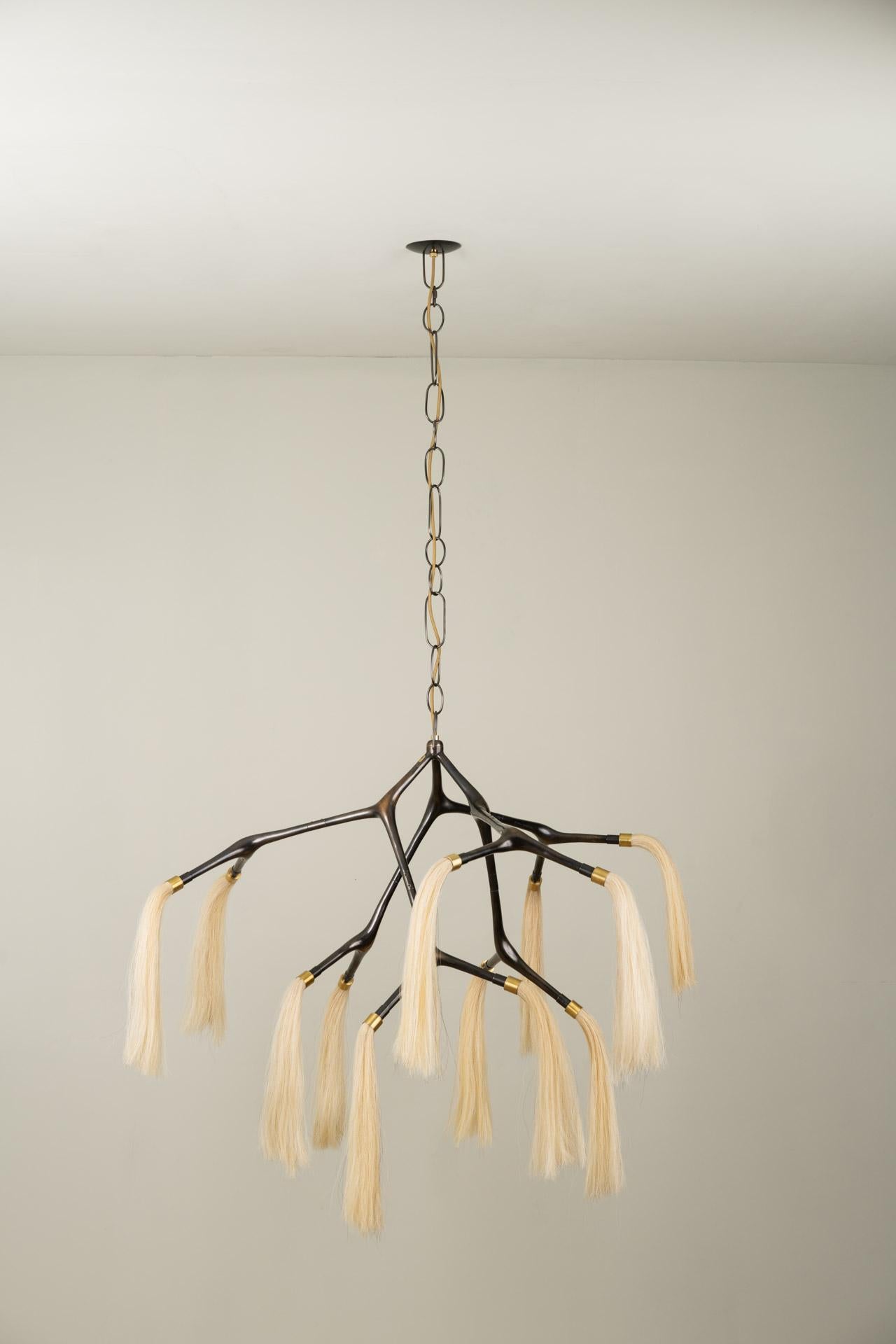 MARATUS chandelier was designed for the Mol collection by Mexican artist Isabel Moncada.

A chestnut horse with a white tail is called Palomino, it is dashing and atypical. This lamp is an allegory of its sumptuous presence. The vintage finish