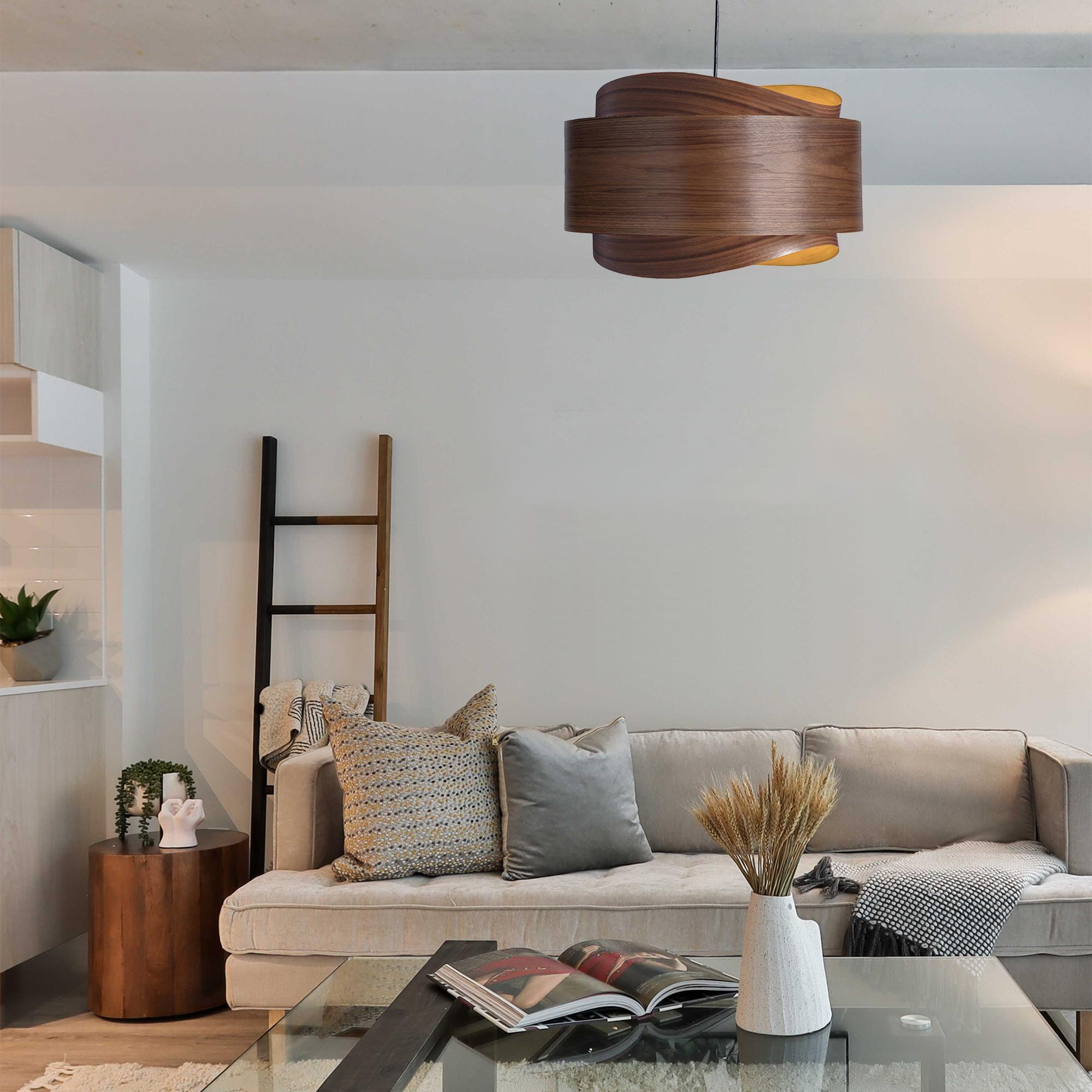 The BOWEN light fixture is a stunning example of contemporary Mid-Century Modern design. With its minimalist silhouette, warm walnut tones, and unique shape, this pendant light is sure to add a touch of sophistication to any space.

The BOWEN light