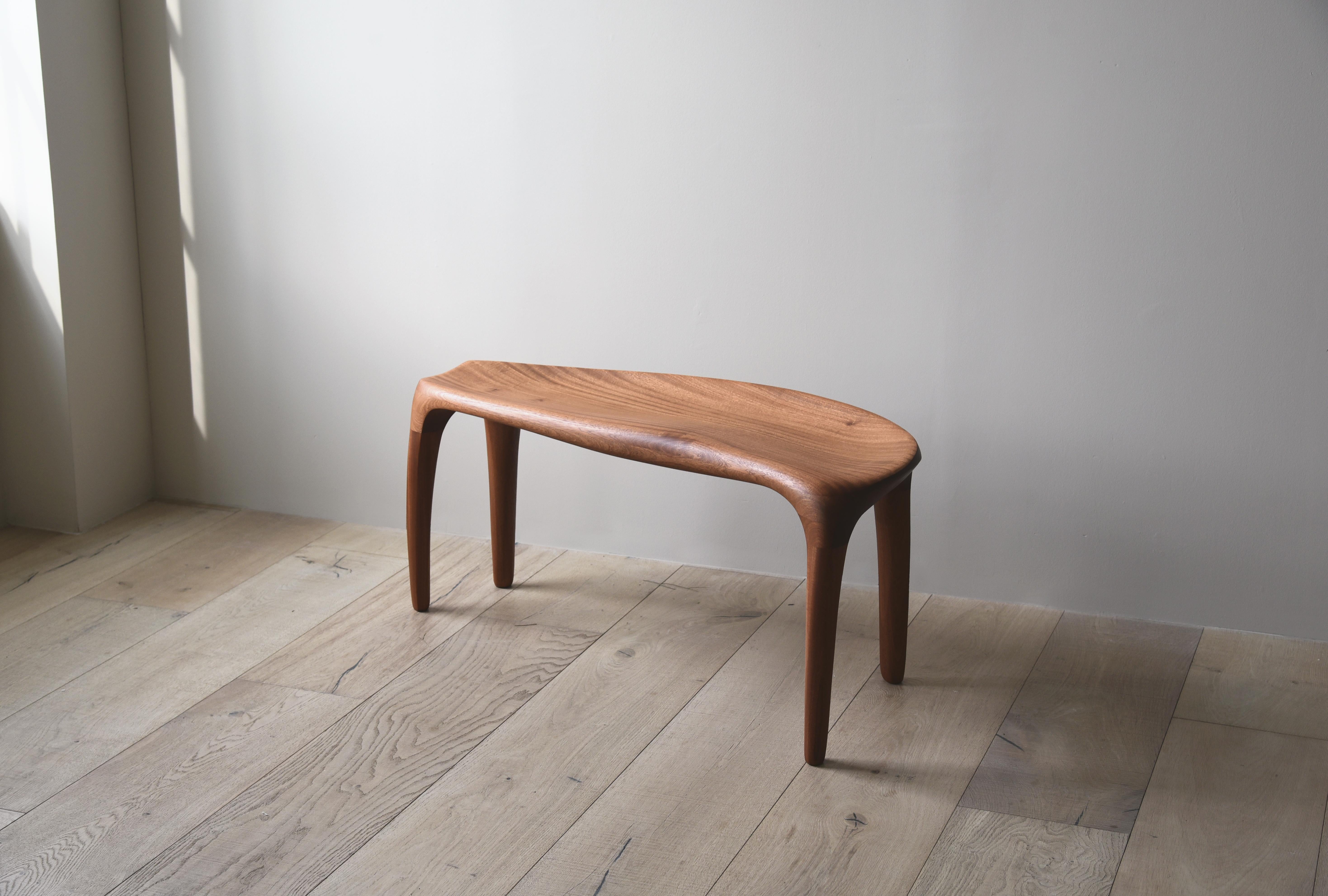 'Motion Bench' by Soo Joo is a sculptural wooden bench in Organic Modernism style. The artist creatively reimagines the essence of traditional Korean aesthetics into a modern minimal context. 

Motion bench is carved out of stack-laminated Sapele