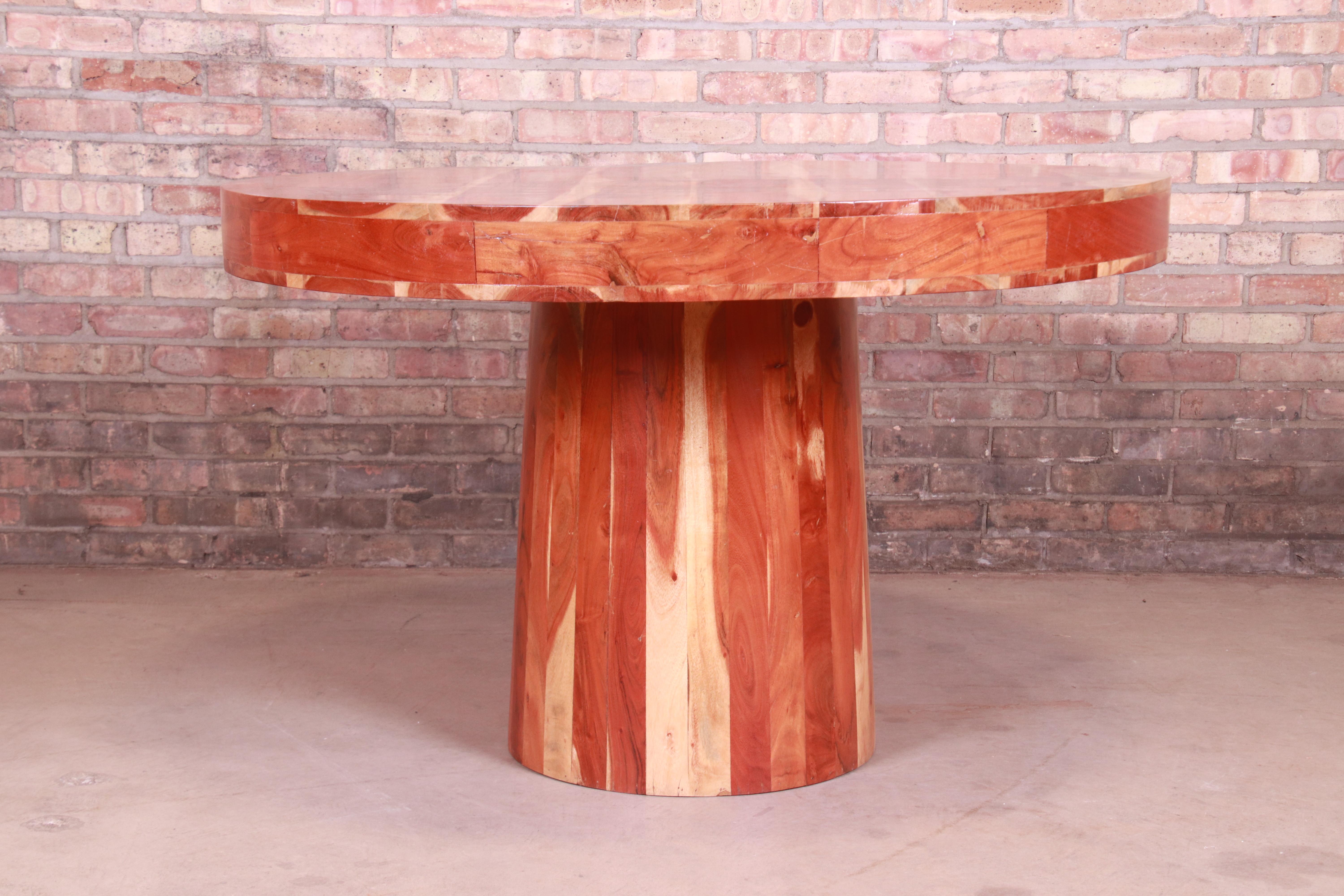 An exceptional organic modern natural solid redwood round pedestal dining table, center table, or game table,

circa 1970s

Measures: 48