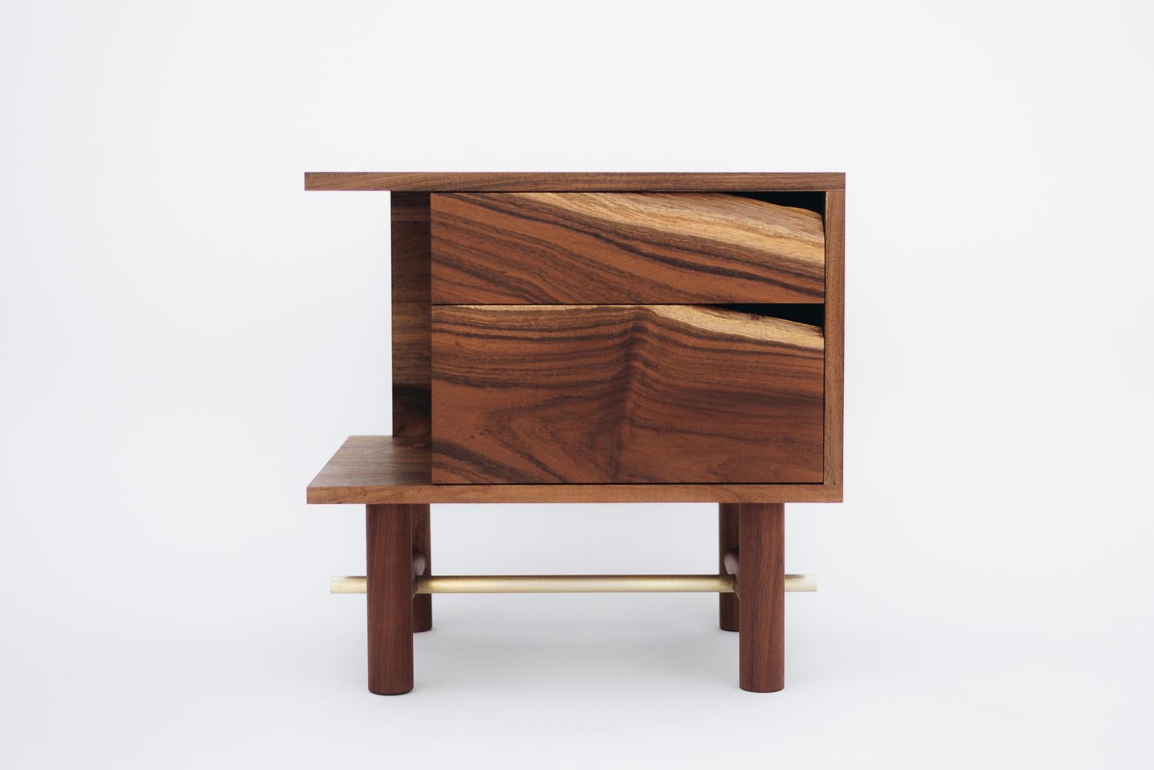 The design of Ocum Nightstand is typified by the search for balanced proportions, simplicity of the basic forms and minimalist construction. The contrasting textures of the Caribbean walnut and the bronze details give it lots of personality.