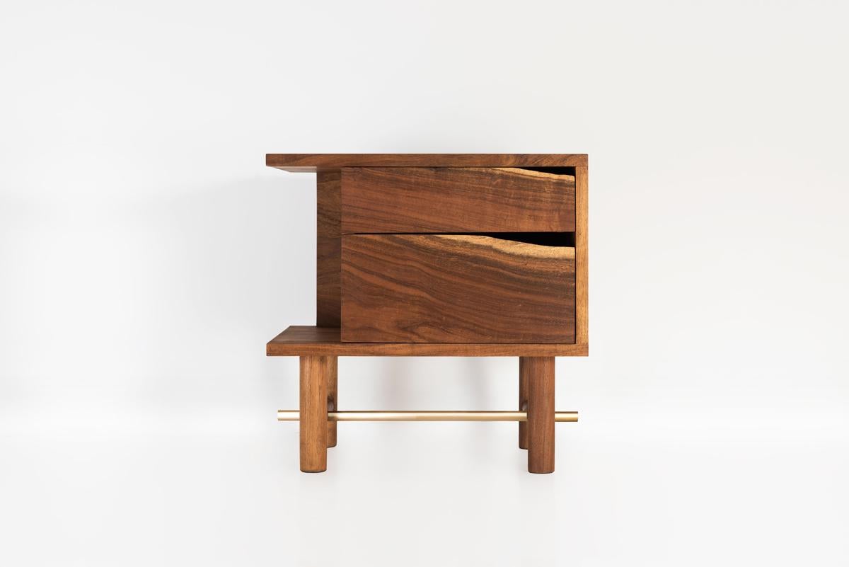 The design of Ocum Nightstand is typified by the search for balanced proportions, simplicity of the basic forms and minimalist construction. The contrasting textures of the Caribbean walnut and the bronze details give it lots of personality.