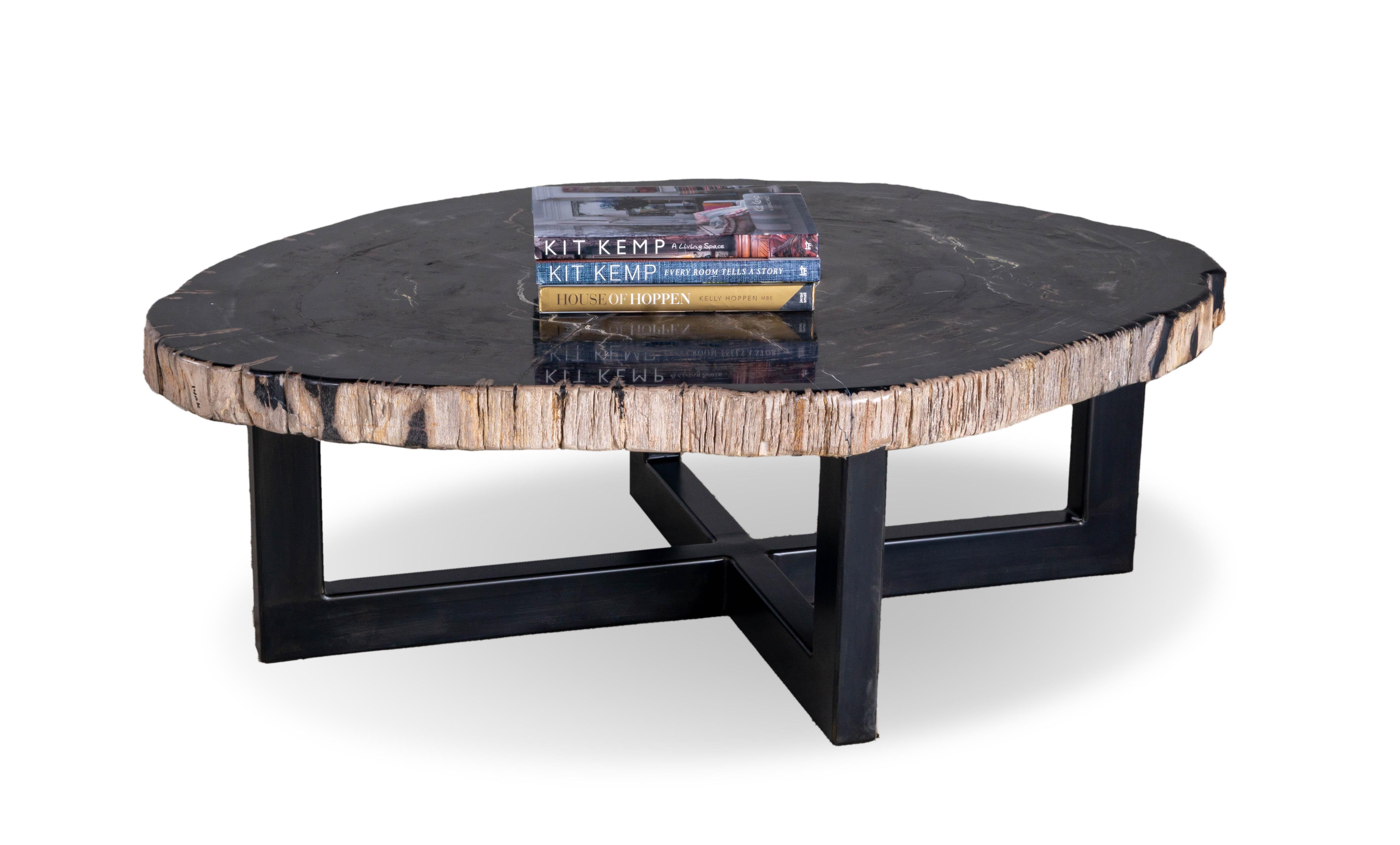 Looking for the perfect piece to make your living room stand out? Introducing this Petrified Wood Coffee Table, the ultimate statement piece that adds an unmistakable touch of modern sophistication and organic style. Crafted with the highest quality