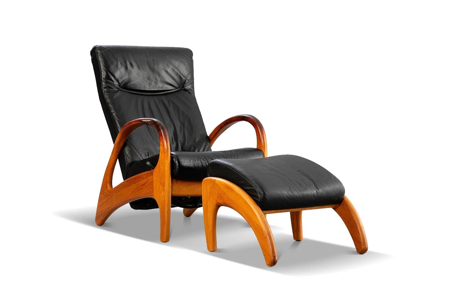 Danish Organic modern reclining teak + leather lounge chair with ottoman