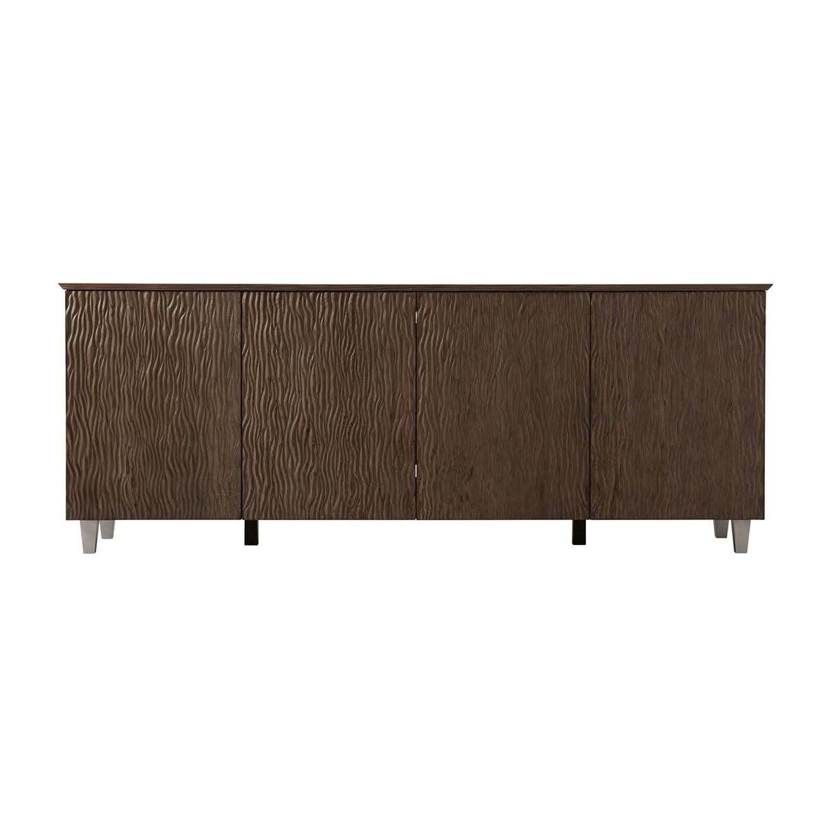 Organic Modern Ripple oak sideboard with a rectangular knife edge top, brushed quarter oak veneers, with four ripple carved oak doors in our Charteris finish raised on square tapered legs.

Dimensions: 80