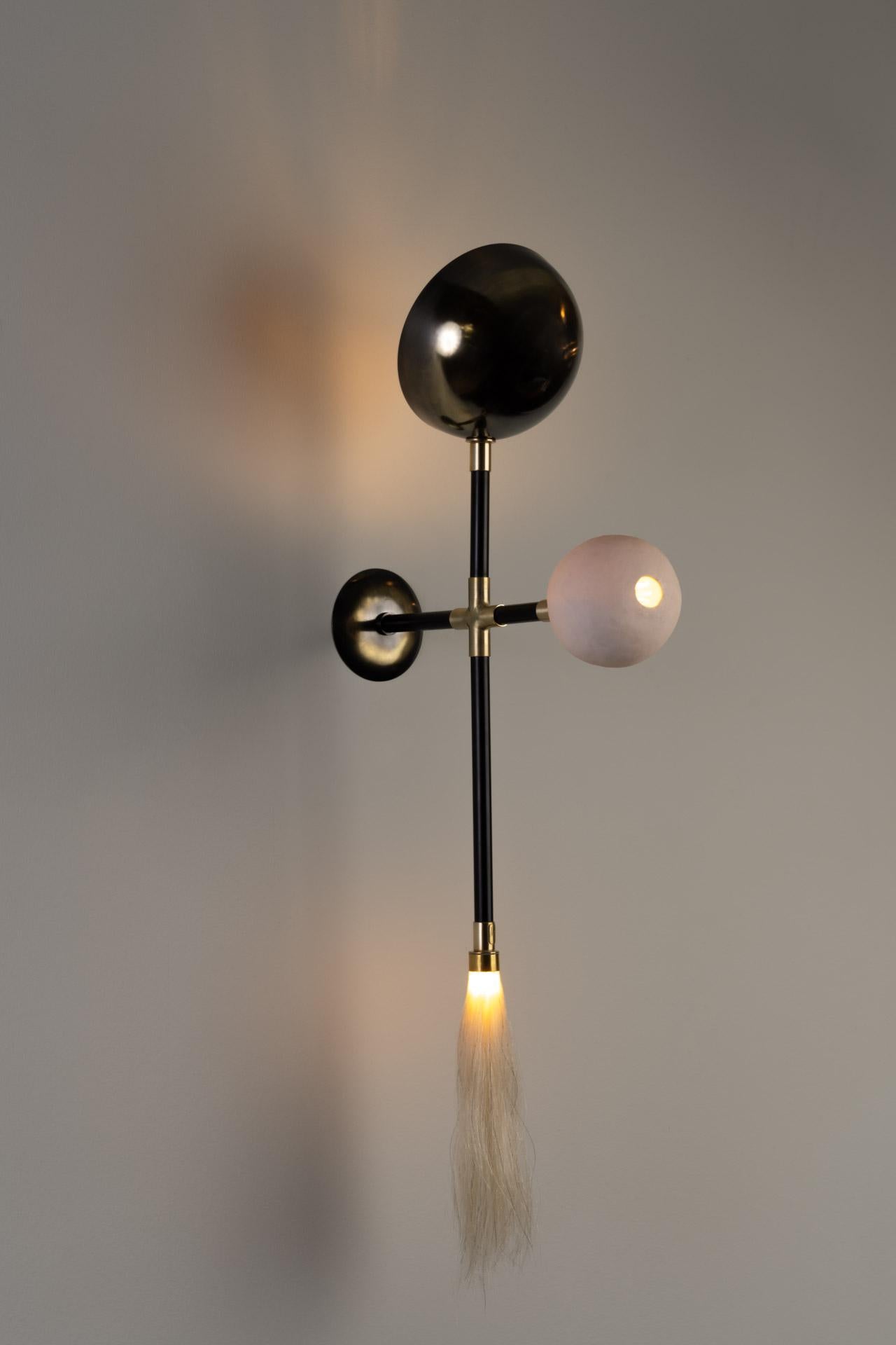 GOGO sconce was designed for the Mol collection by Mexican artist Isabel Moncada.

Go-go, a term used in the ’60s to describe a frantic, pulsating expression of joyful go, go, go… The three significant elements light up in this cross and the