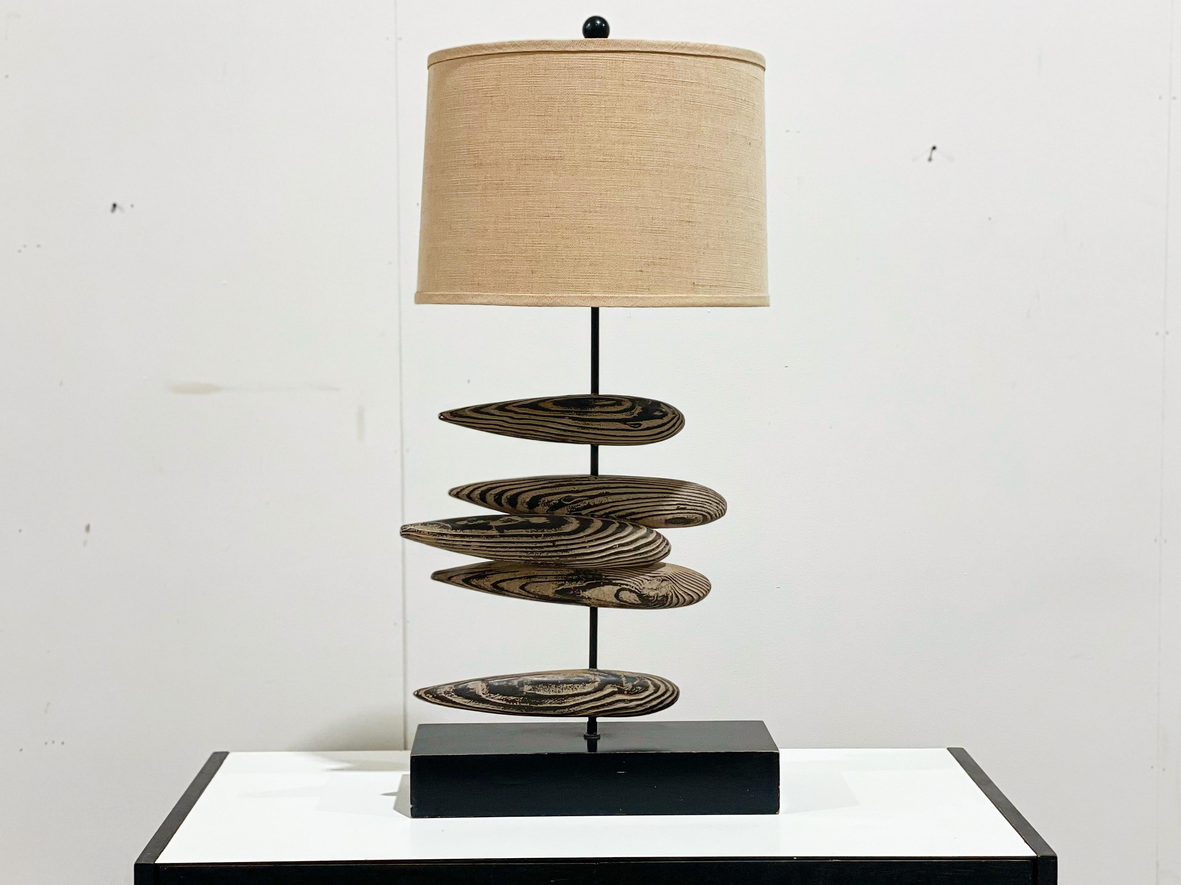 Midcentury modern sculpted faux driftwood abstract fish table lamp. Gorgeous form and superb craftsmanship. 
Overall excellent condition. Black lacquered wood block base. Wiring and components in good working order. Original shade in excellent