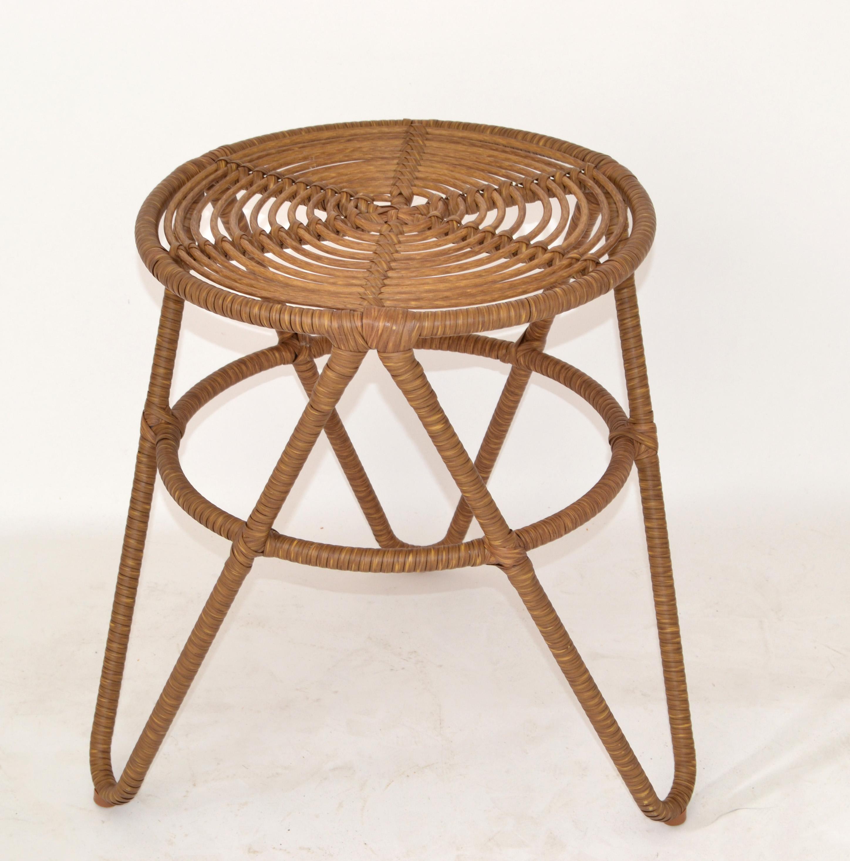 Organic Modern Taupe 3-legged stool in hand-woven Cane bindings over wrought Iron and Foot glides in plastic.
Asian Style made in the late 20th Century.
Marked at the Base, Made in Vietnam.
In very good condition and ready for a new Home