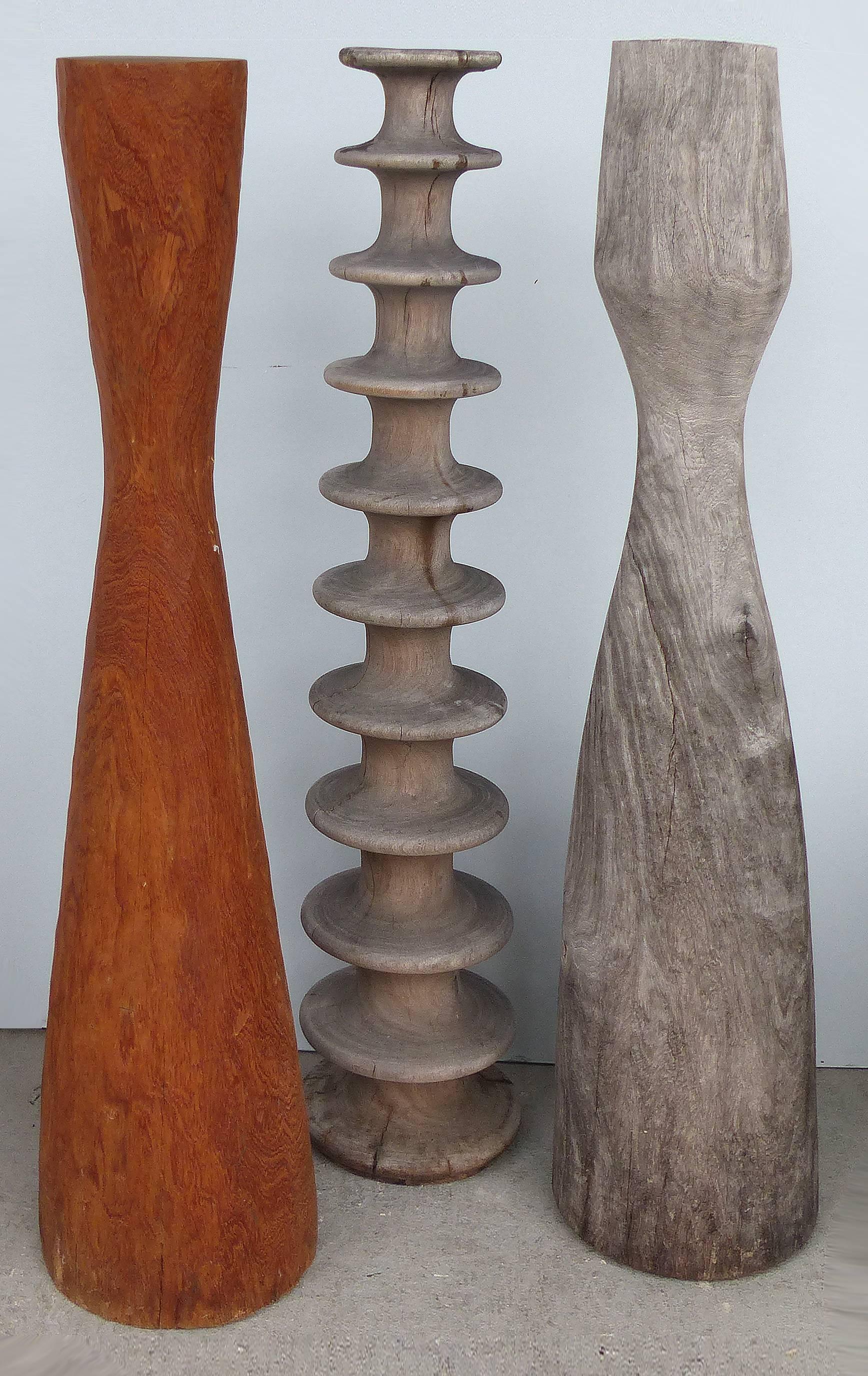 Offered for sale are three individual sculptural decorative columns. Each has its own characteristics and is sold individually. The measurements are as follows: Spindle column, 39.5