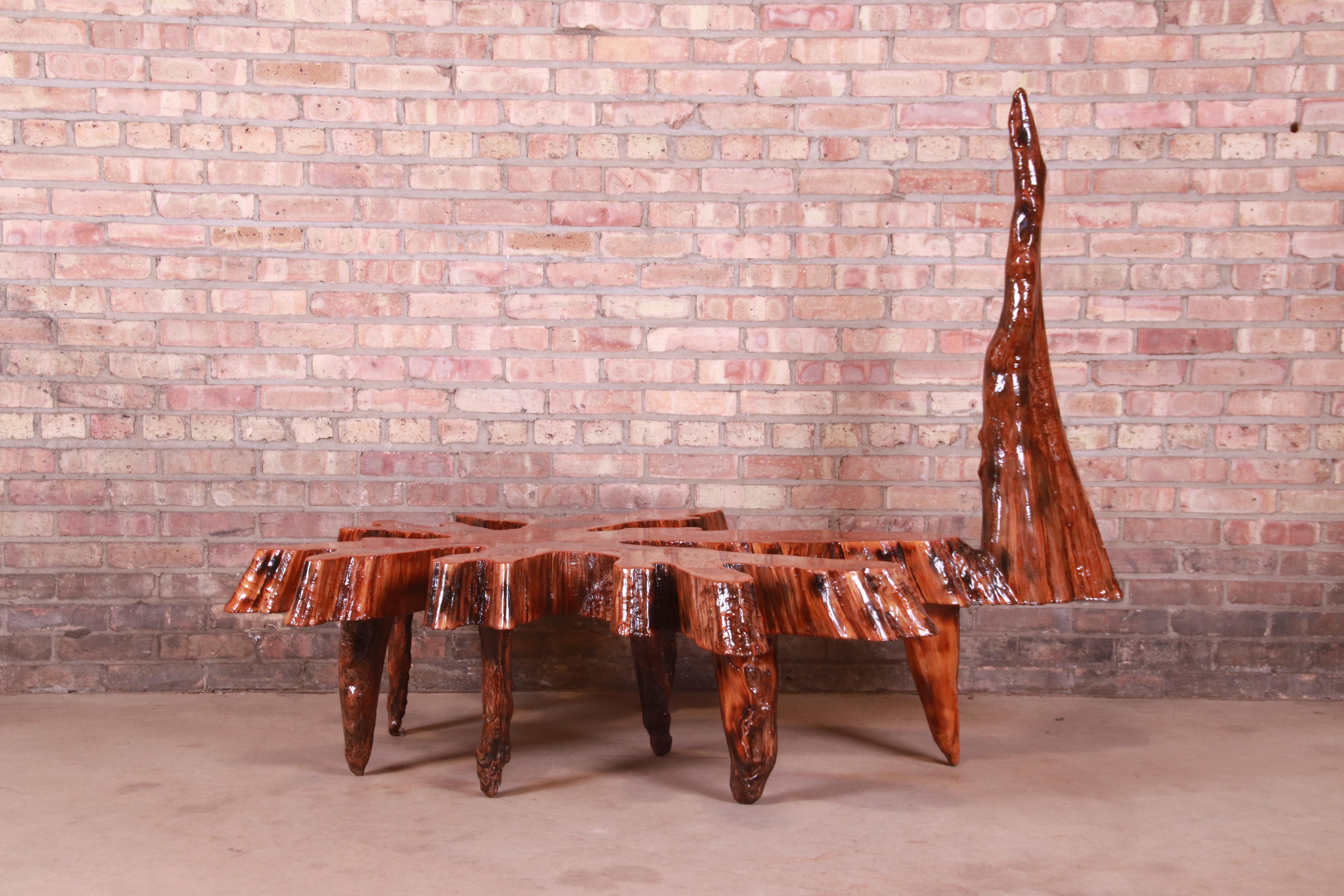 An exceptional organic modern natural solid cypress slab coffee table in unique sculptural form

USA, Circa 1970s

Measures: 67