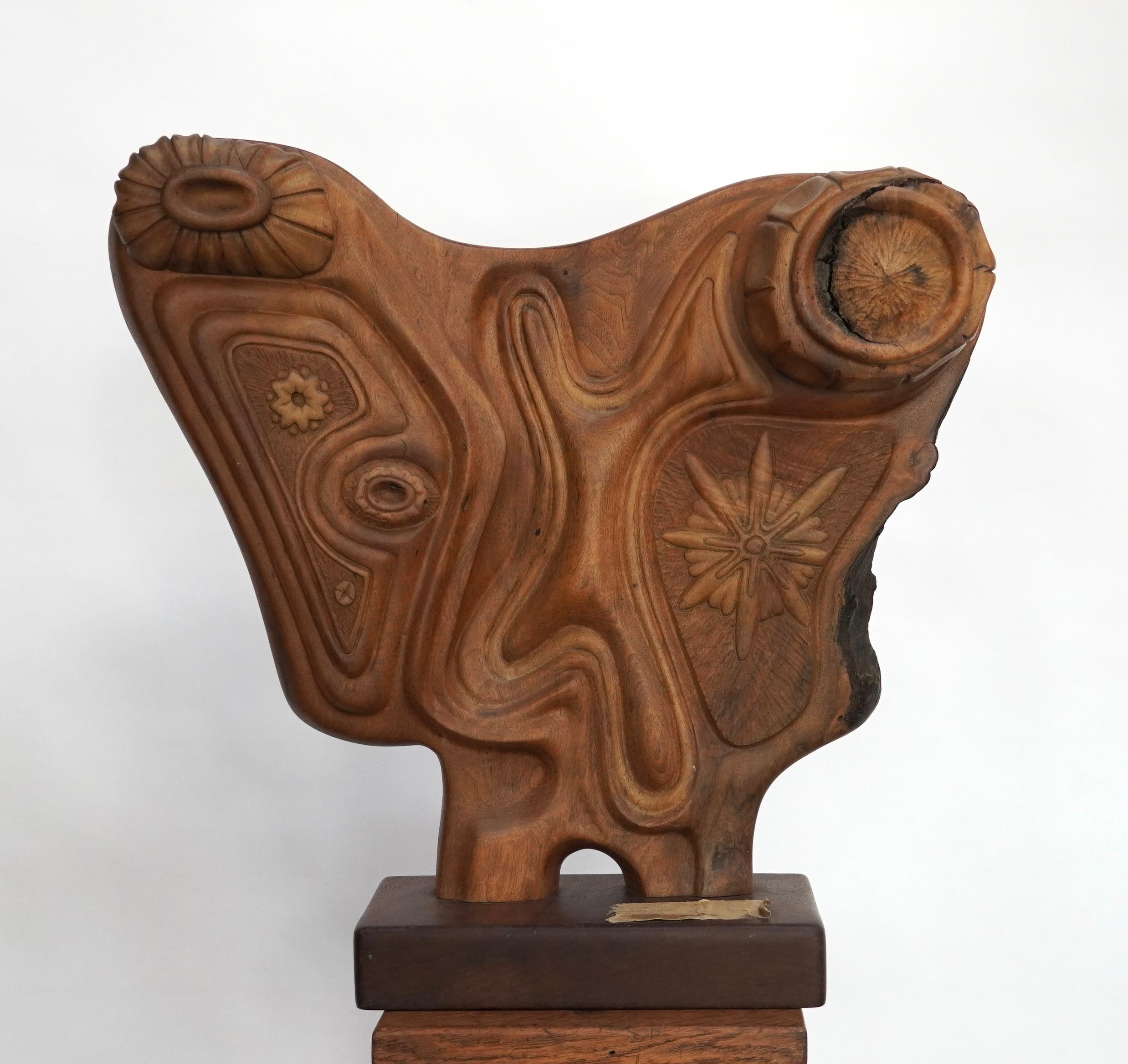 A Organic Modern sculpture with presence in both scale and level of skill by Northern California artist Trent Williams. Handcarved walnut with intricate detail with various organic forms pulled from nature throughout the entire piece. Still retains