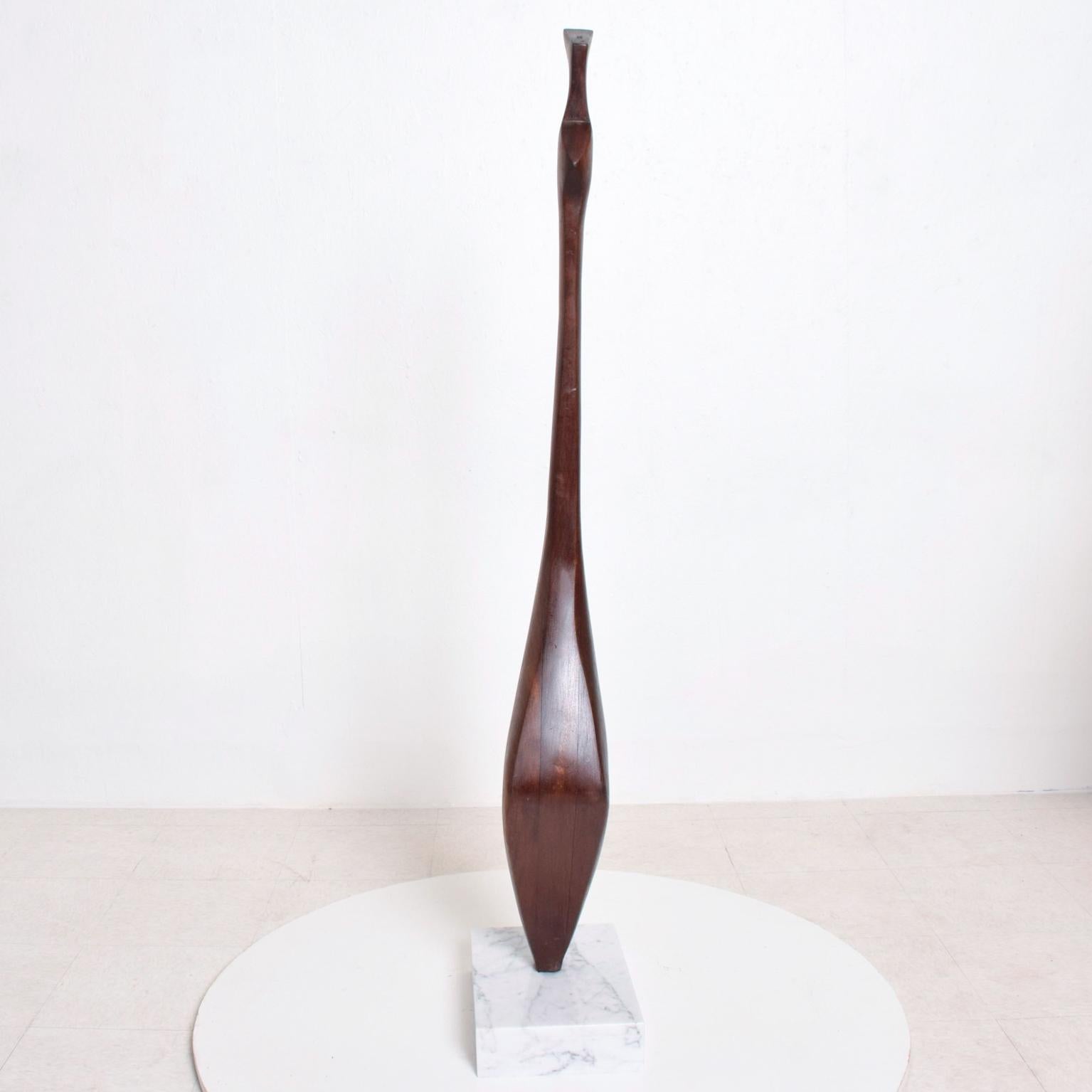 AMBIANIC presents
Organic Modern abstract sculpture in Walnut Wood mounted on a White Carrara Marble Base.
Unsigned. Style representative of George Nakashima Free Form.
USA 1960s
Dimensions: 58H x 13.5 D x 9.25 W. inches
Preowned vintage in very