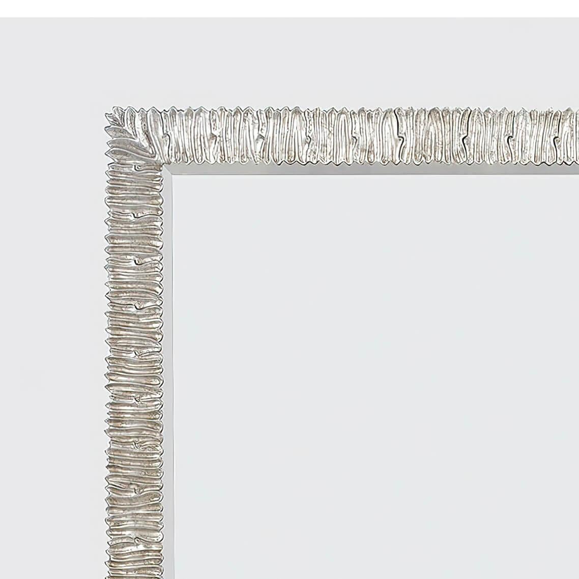 An organic modern silver leaf formed and molded rectangular wall mirror. This mirror can be hung horizontally or vertically. The silver leaf finish is applied to an aluminum cast frame.

Dimensions: 38