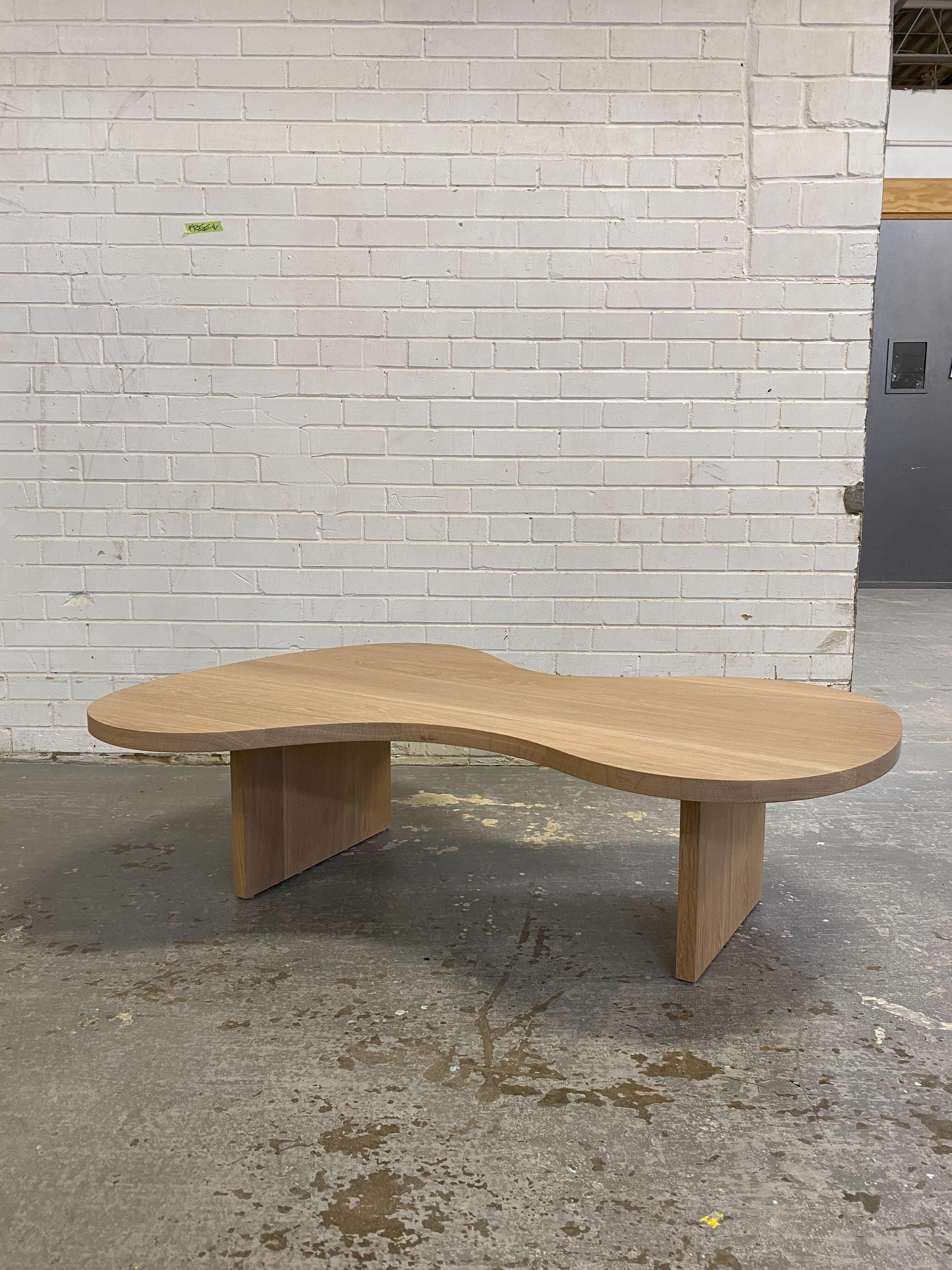 Handmade in Toronto on by Mary Ratcliffe Studio & constructed out of solid flat cut white oak with an oiled natural finish, this curvy yet contemporary piece makes for the perfect coffee table or centre piece. 

As we make everything by hand, in